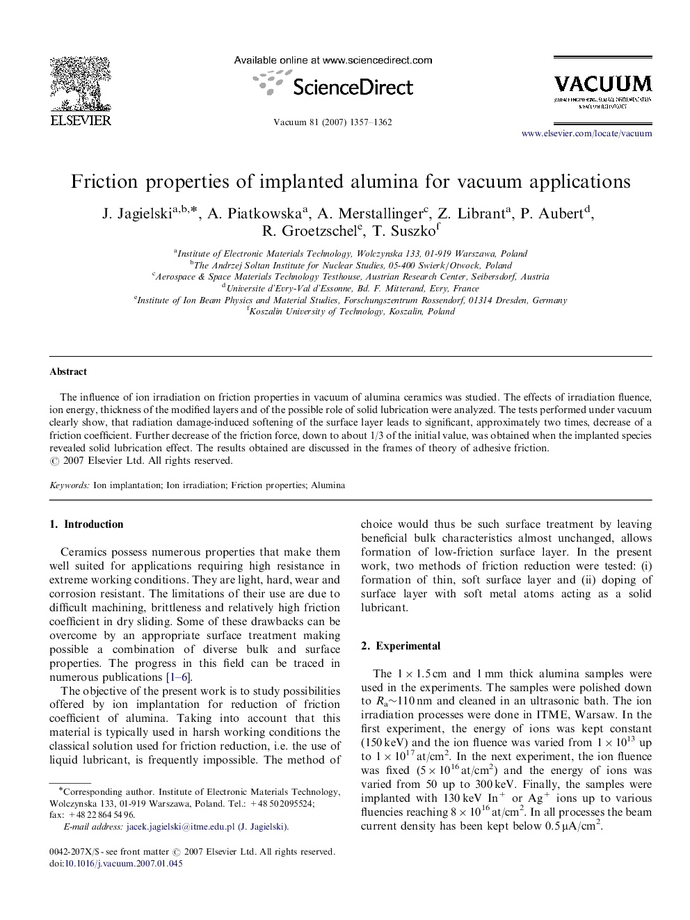 Friction properties of implanted alumina for vacuum applications