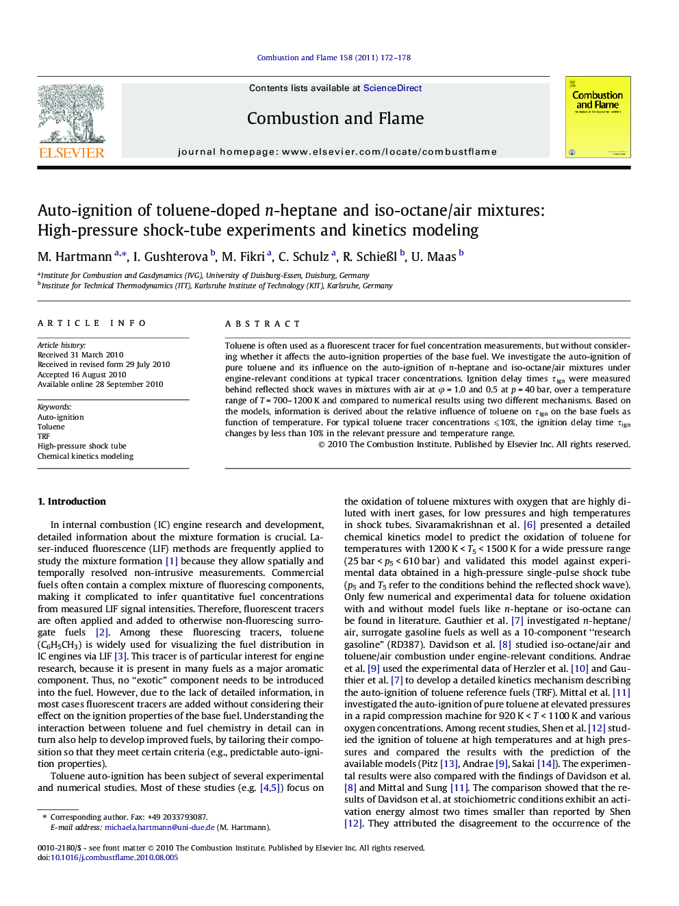 Auto-ignition of toluene-doped n-heptane and iso-octane/air mixtures: High-pressure shock-tube experiments and kinetics modeling