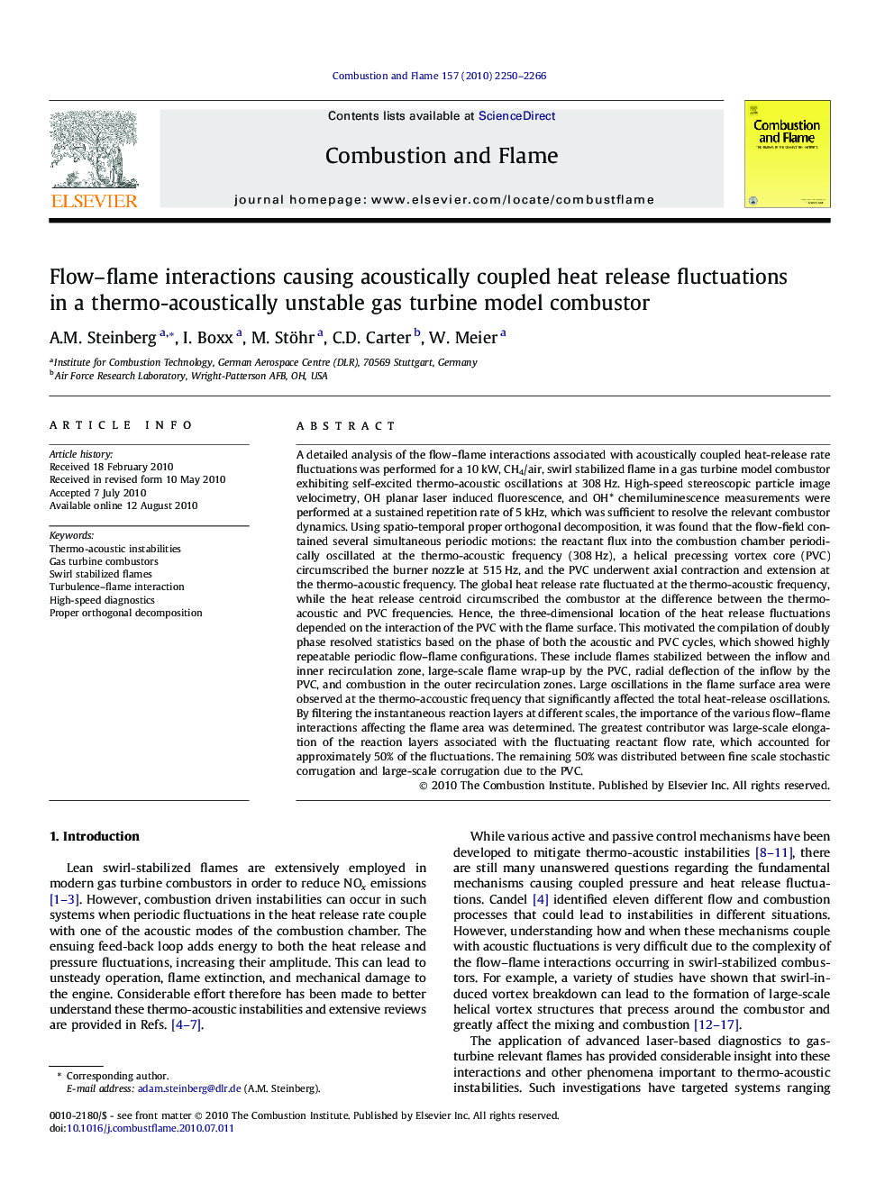 Flow–flame interactions causing acoustically coupled heat release fluctuations in a thermo-acoustically unstable gas turbine model combustor