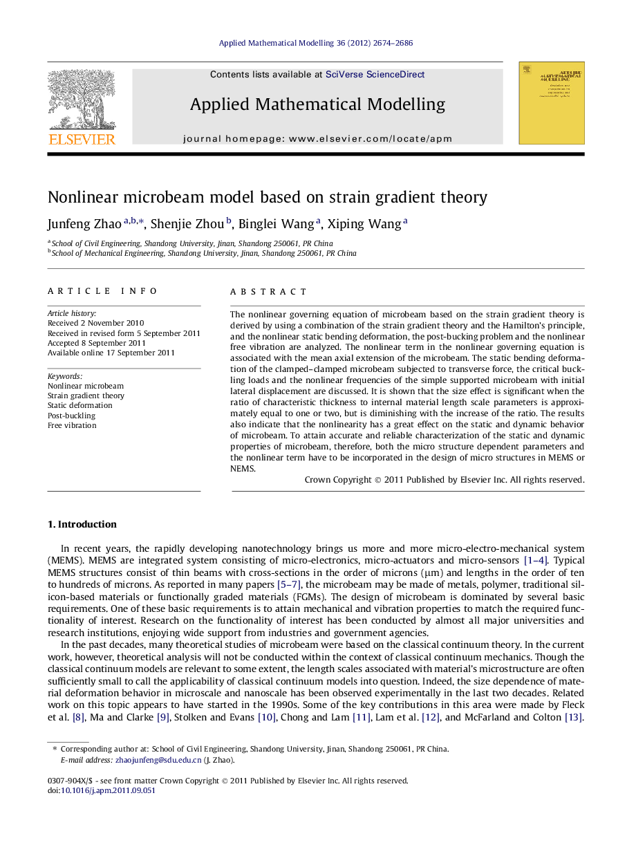 Nonlinear microbeam model based on strain gradient theory