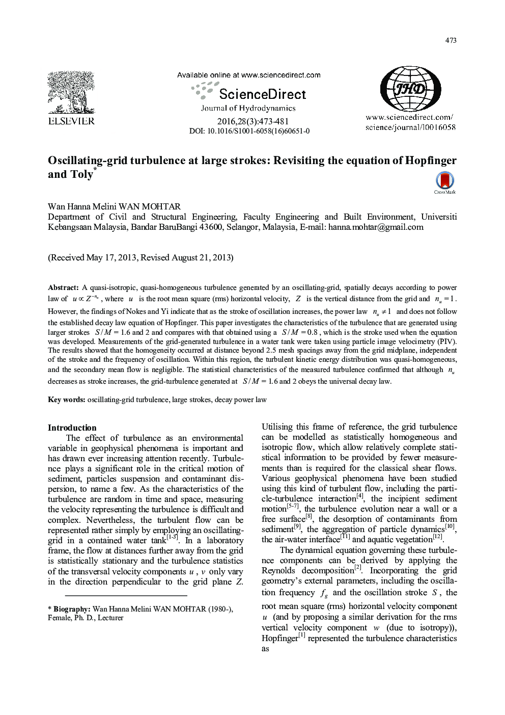 Oscillating-grid turbulence at large strokes: Revisiting the equation of Hopfinger and Toly