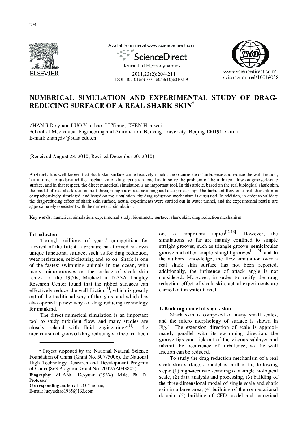 Numerical simulation and experimental study of drag-reducing surface of a real shark skin 