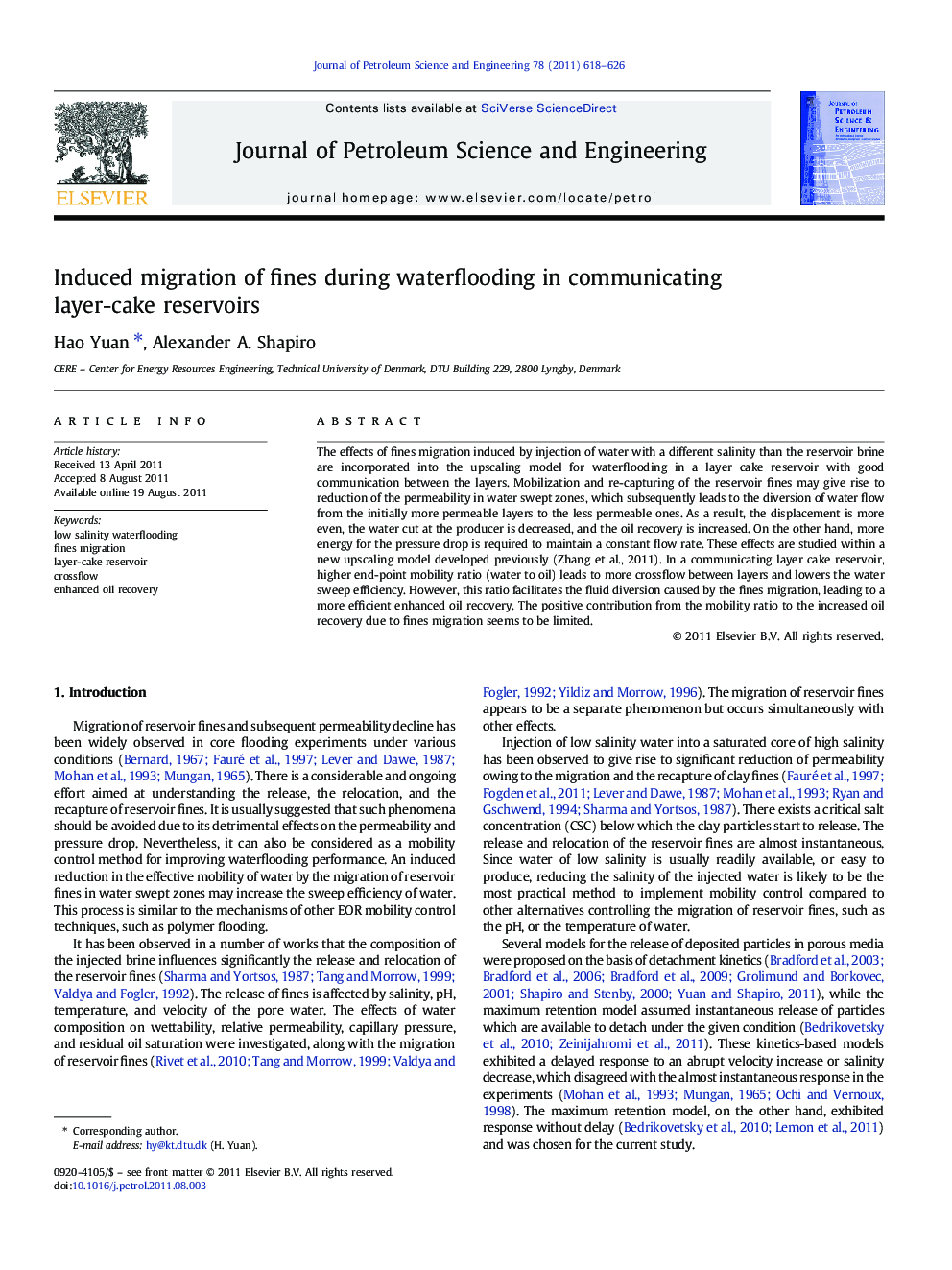 Induced migration of fines during waterflooding in communicating layer-cake reservoirs