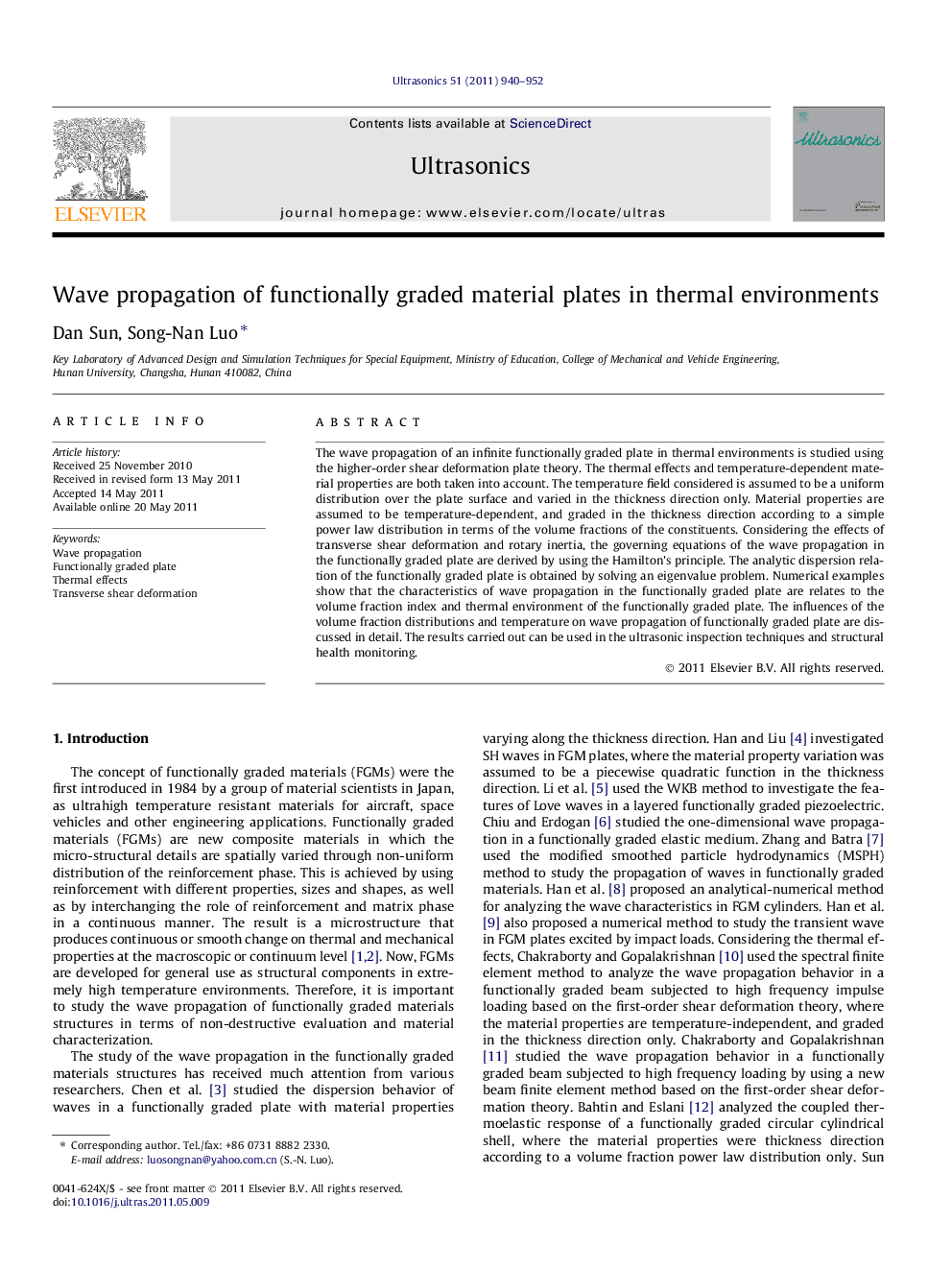 Wave propagation of functionally graded material plates in thermal environments