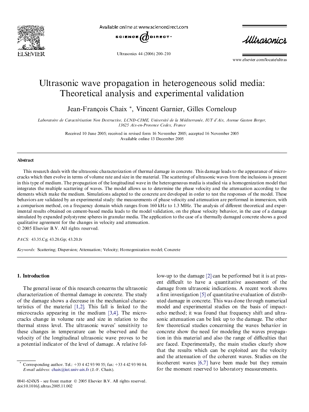 Ultrasonic wave propagation in heterogeneous solid media: Theoretical analysis and experimental validation