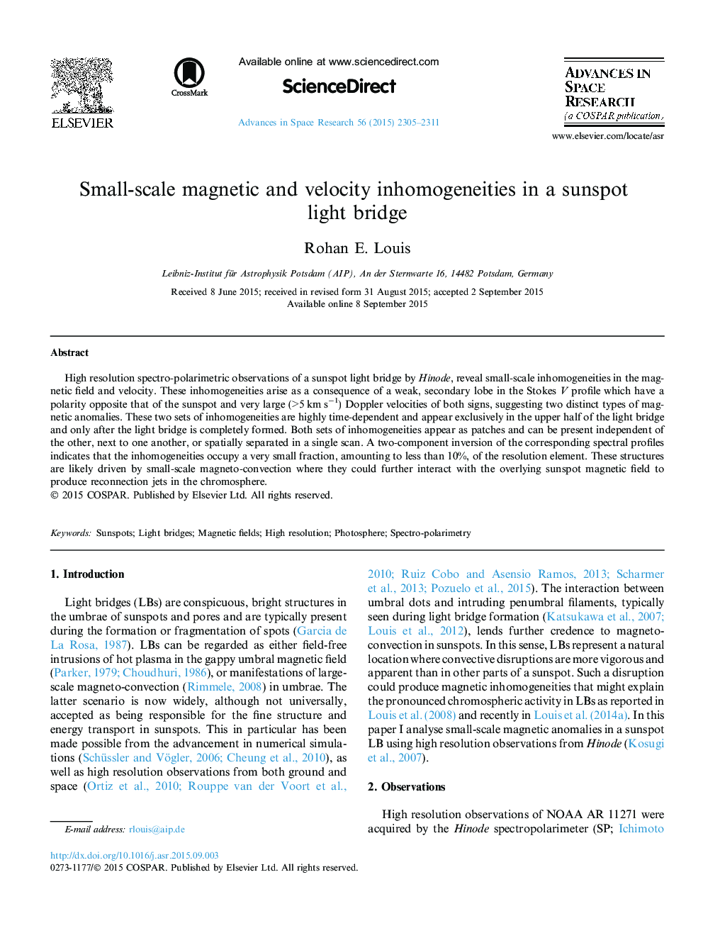 Small-scale magnetic and velocity inhomogeneities in a sunspot light bridge