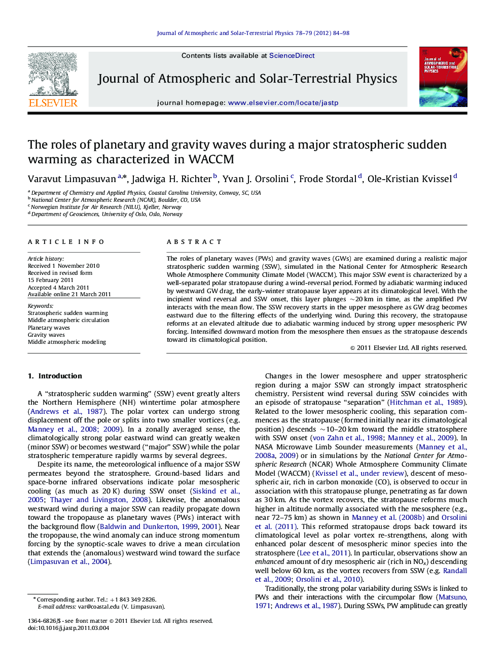 The roles of planetary and gravity waves during a major stratospheric sudden warming as characterized in WACCM