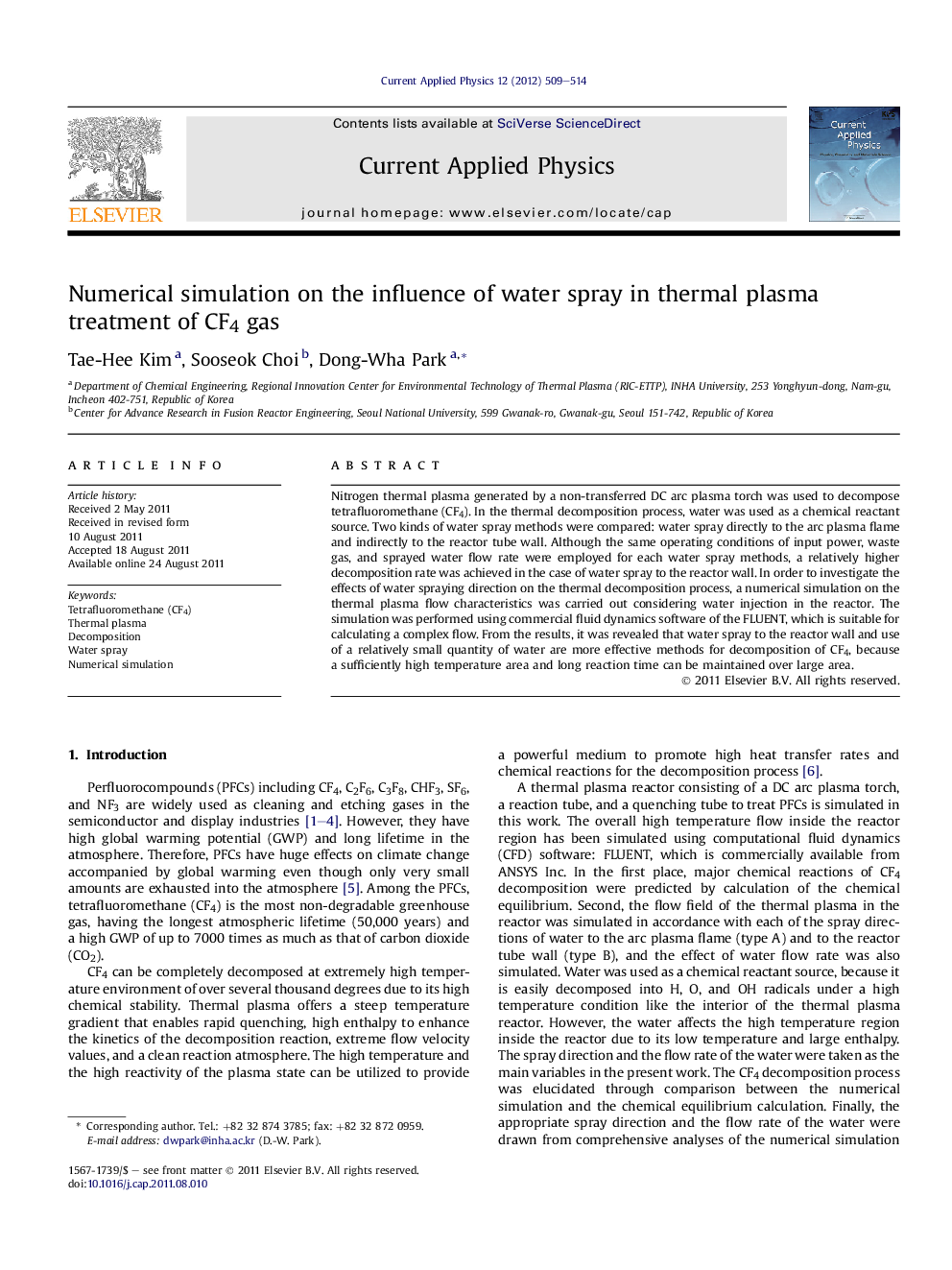 Numerical simulation on the influence of water spray in thermal plasma treatment of CF4 gas