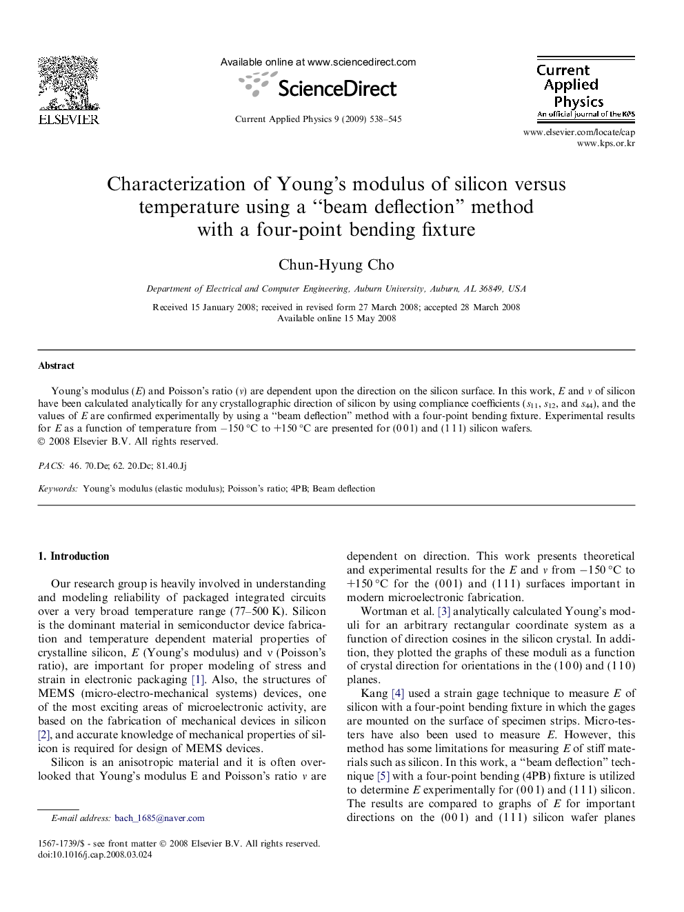 Characterization of Young’s modulus of silicon versus temperature using a “beam deflection” method with a four-point bending fixture