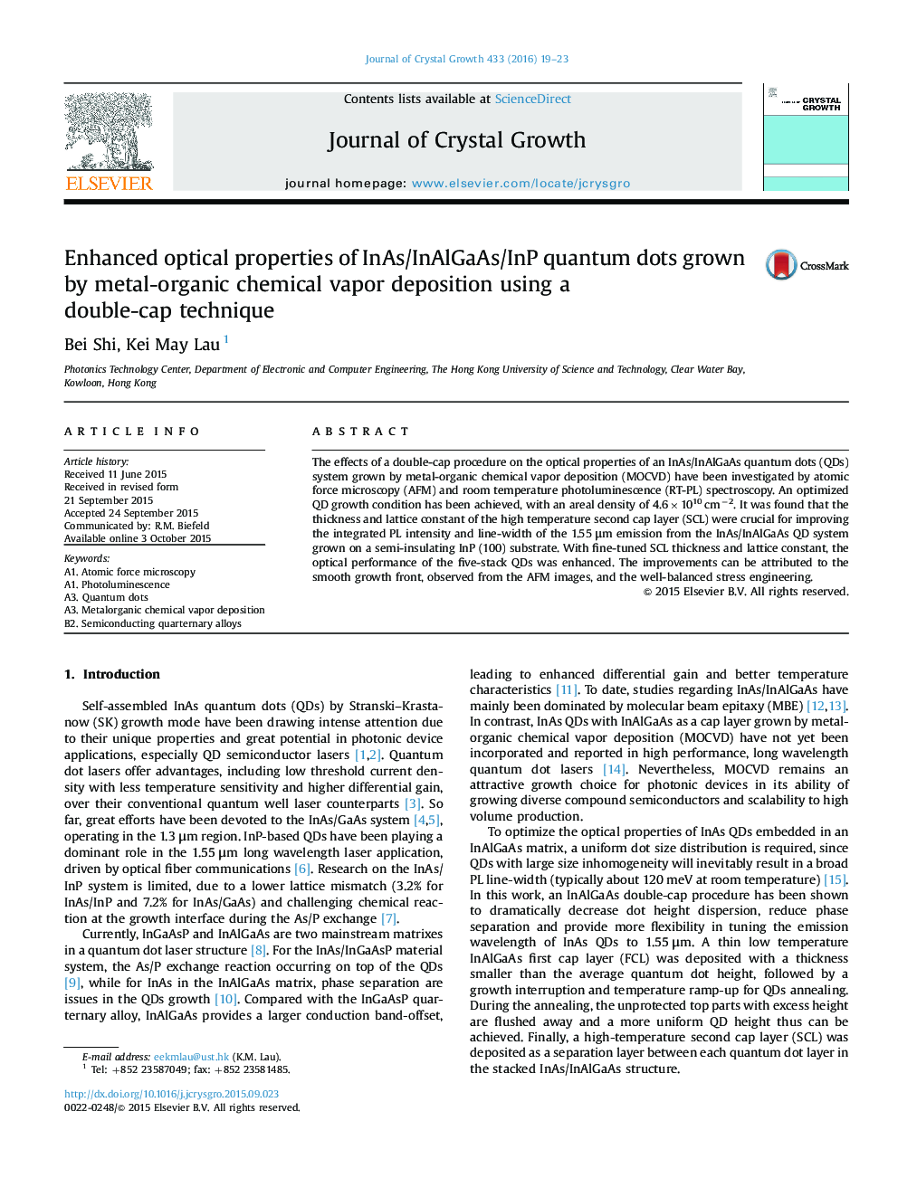 Enhanced optical properties of InAs/InAlGaAs/InP quantum dots grown by metal-organic chemical vapor deposition using a double-cap technique