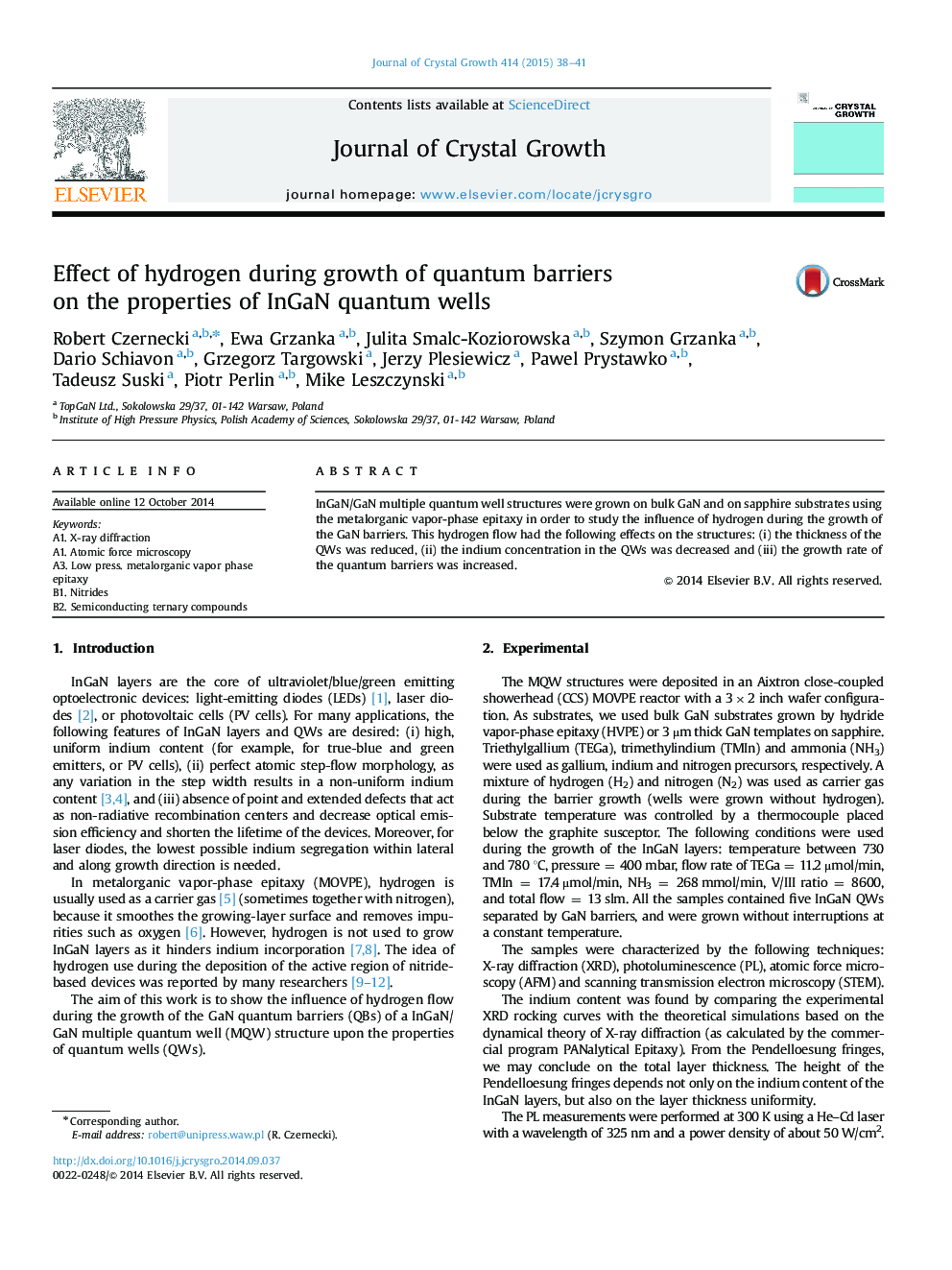 Effect of hydrogen during growth of quantum barriers on the properties of InGaN quantum wells