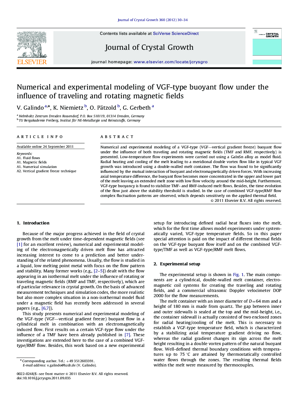 Numerical and experimental modeling of VGF-type buoyant flow under the influence of traveling and rotating magnetic fields