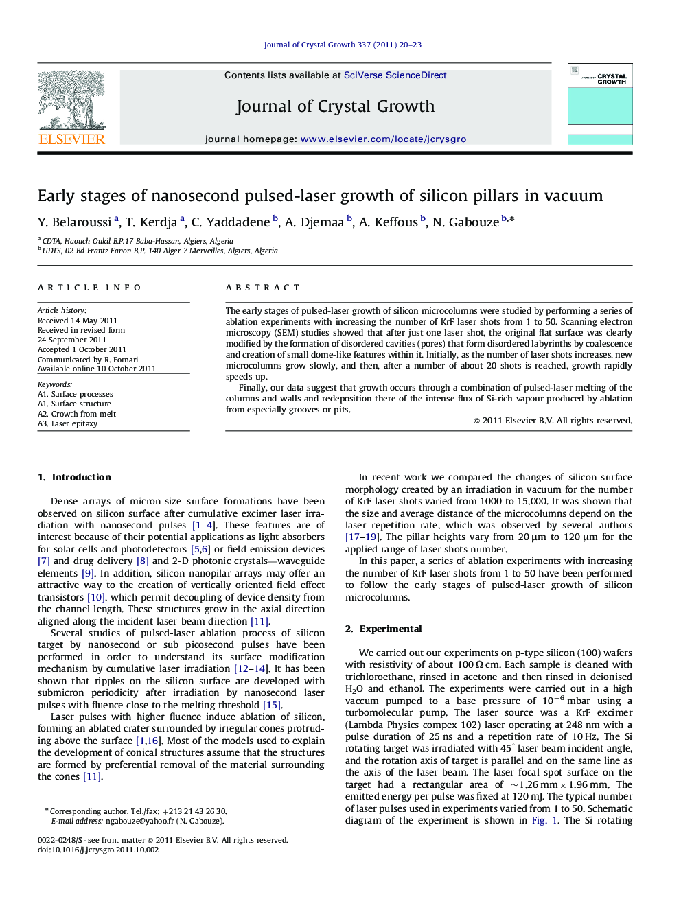 Early stages of nanosecond pulsed-laser growth of silicon pillars in vacuum