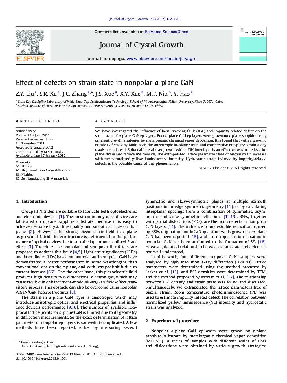 Effect of defects on strain state in nonpolar a-plane GaN