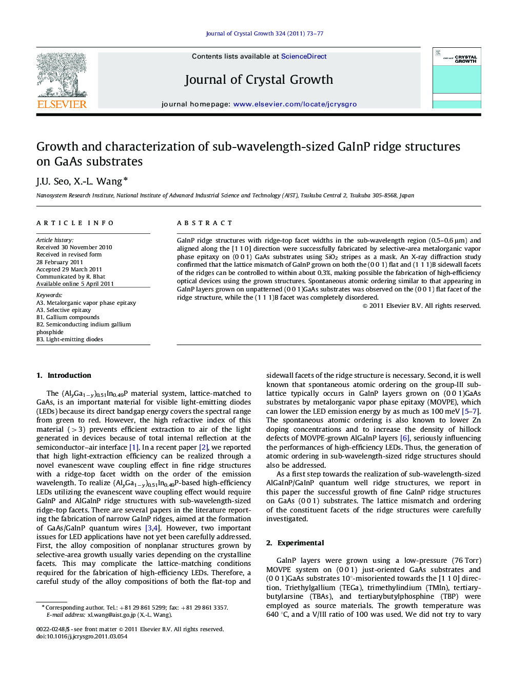 Growth and characterization of sub-wavelength-sized GaInP ridge structures on GaAs substrates