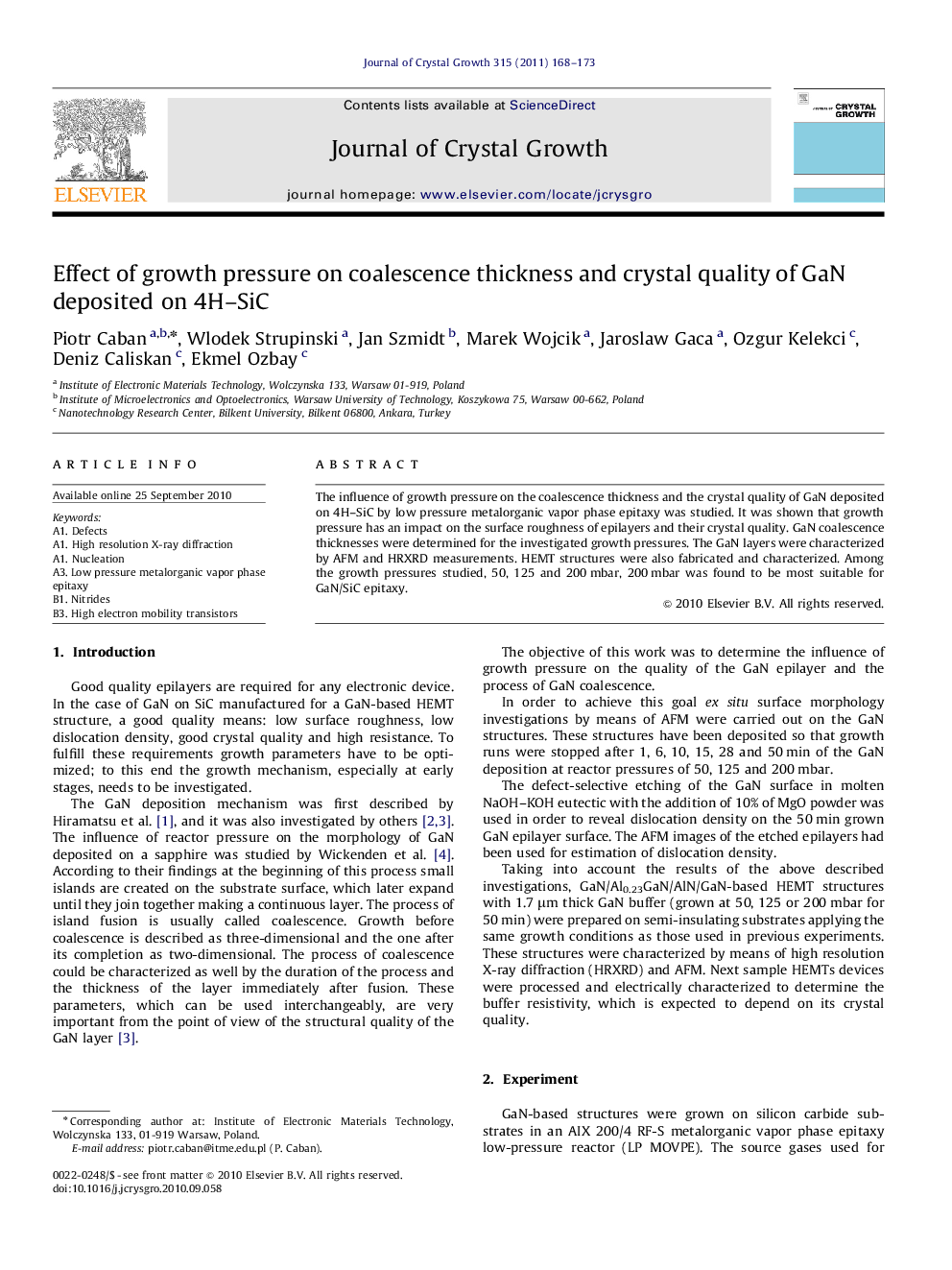 Effect of growth pressure on coalescence thickness and crystal quality of GaN deposited on 4H–SiC