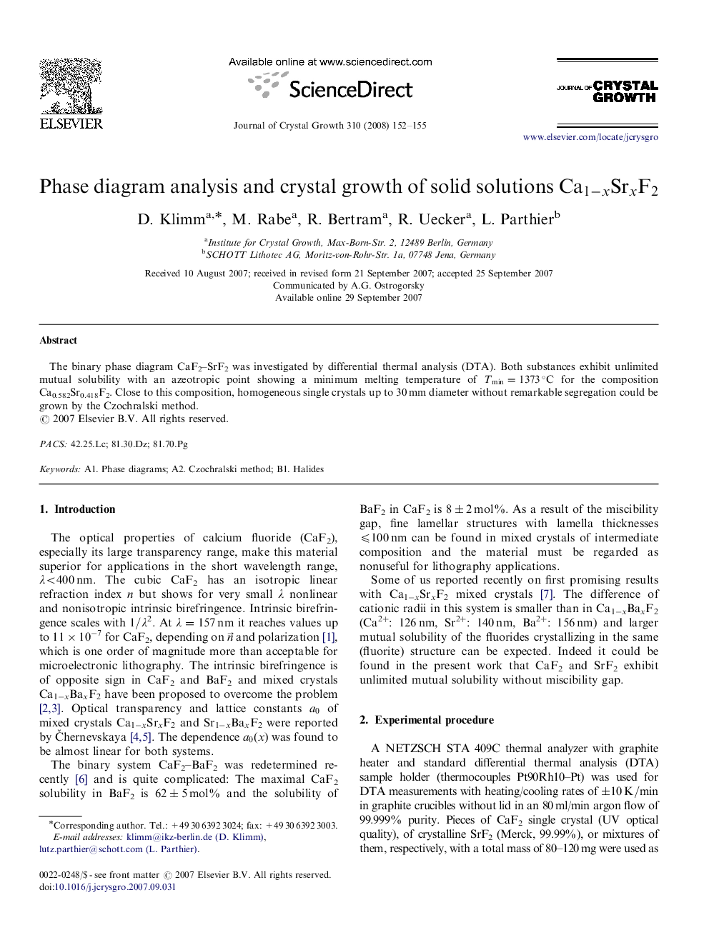 Phase diagram analysis and crystal growth of solid solutions Ca1-xSrxF2