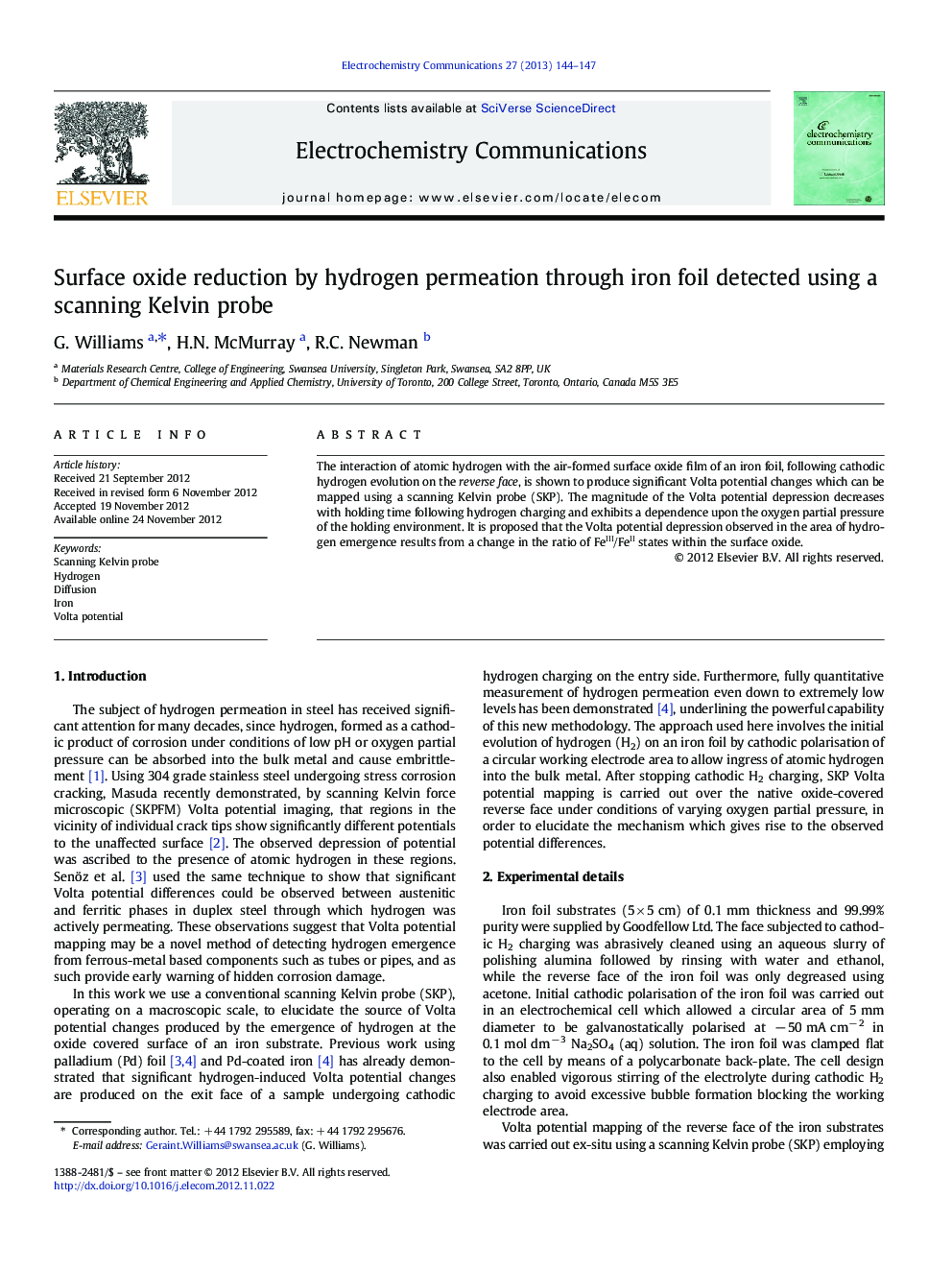 Surface oxide reduction by hydrogen permeation through iron foil detected using a scanning Kelvin probe