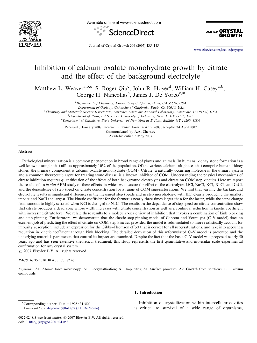 Inhibition of calcium oxalate monohydrate growth by citrate and the effect of the background electrolyte