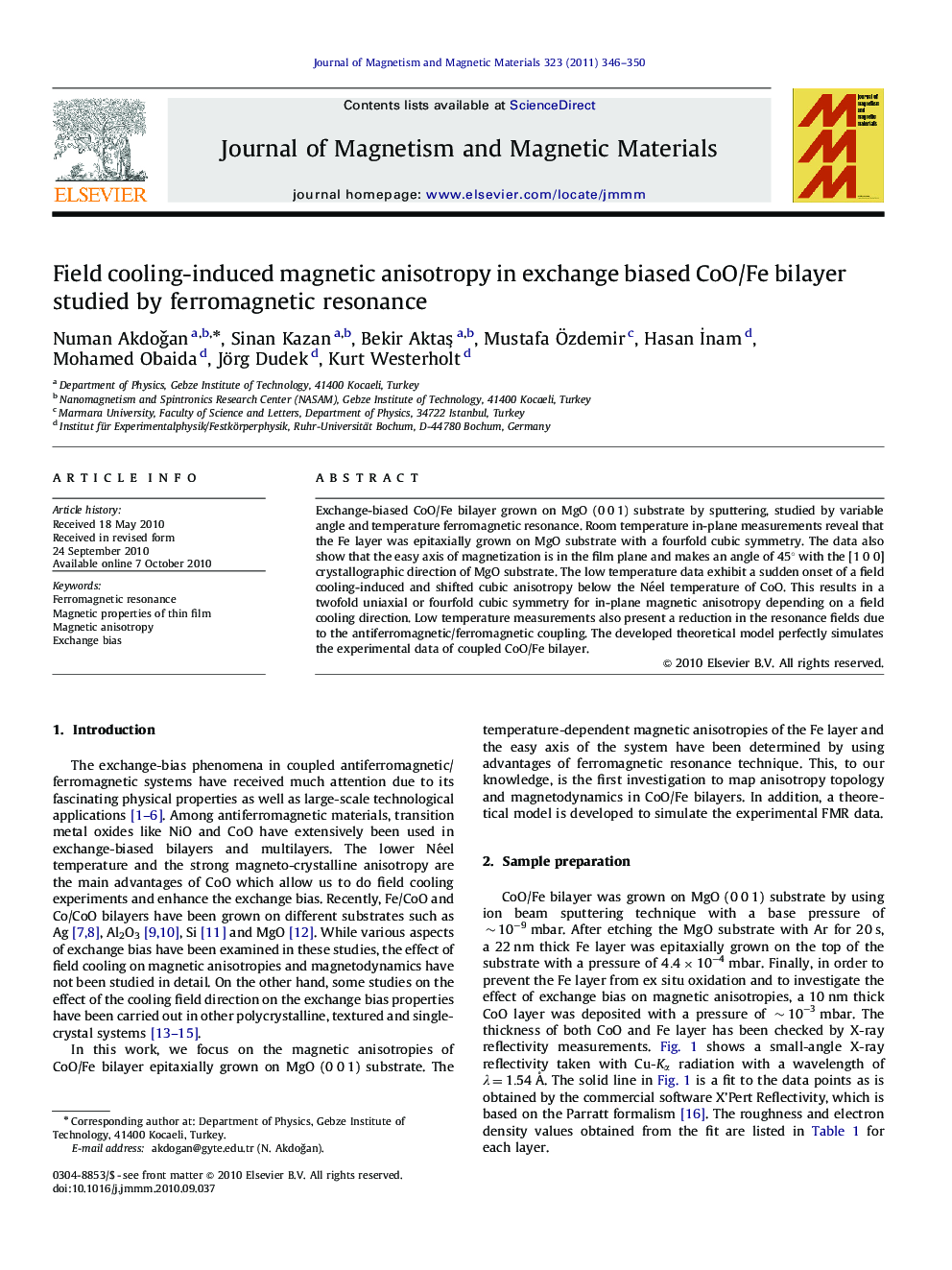 Field cooling-induced magnetic anisotropy in exchange biased CoO/Fe bilayer studied by ferromagneticresonance