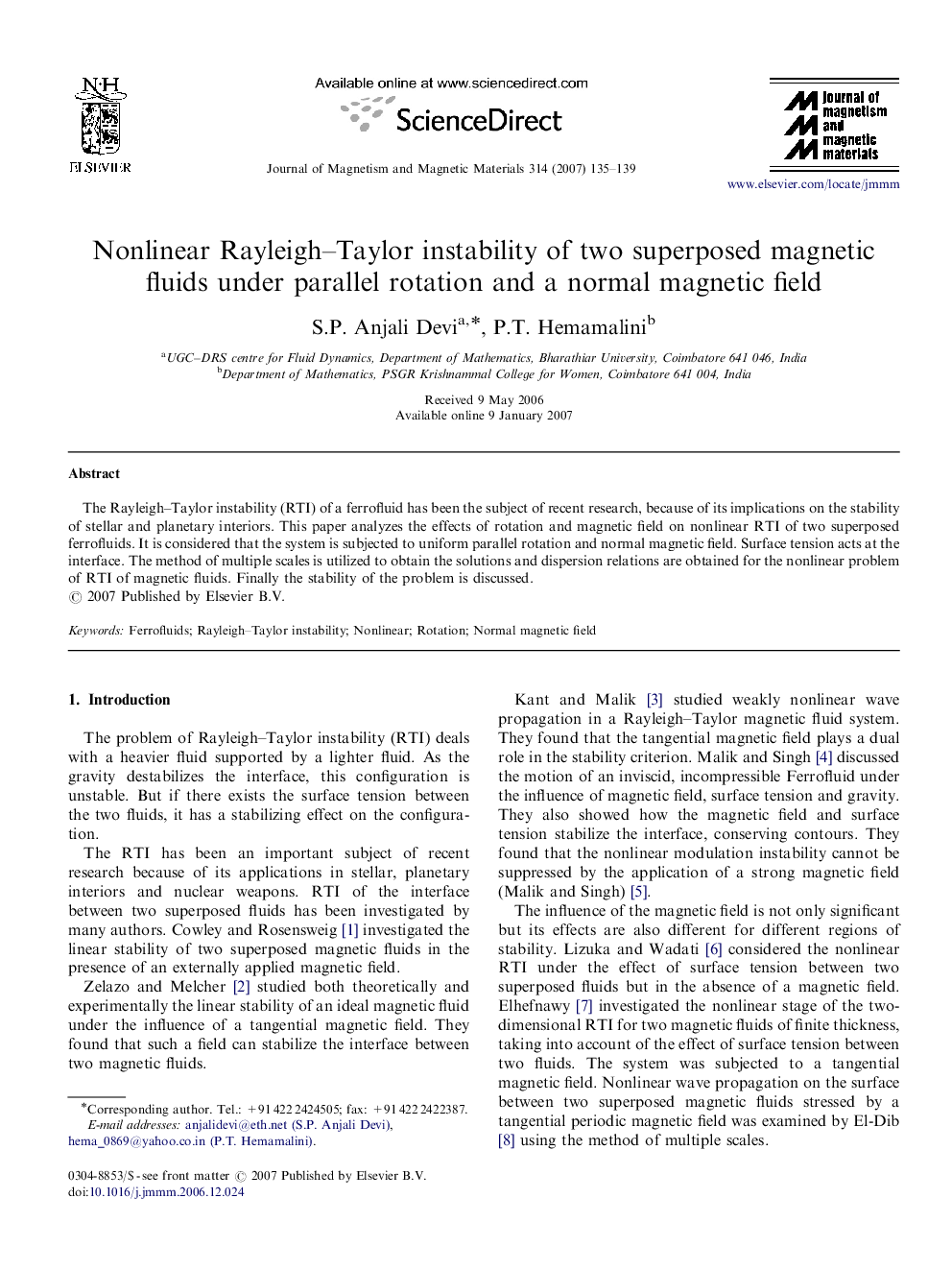 Nonlinear Rayleigh–Taylor instability of two superposed magnetic fluids under parallel rotation and a normal magnetic field