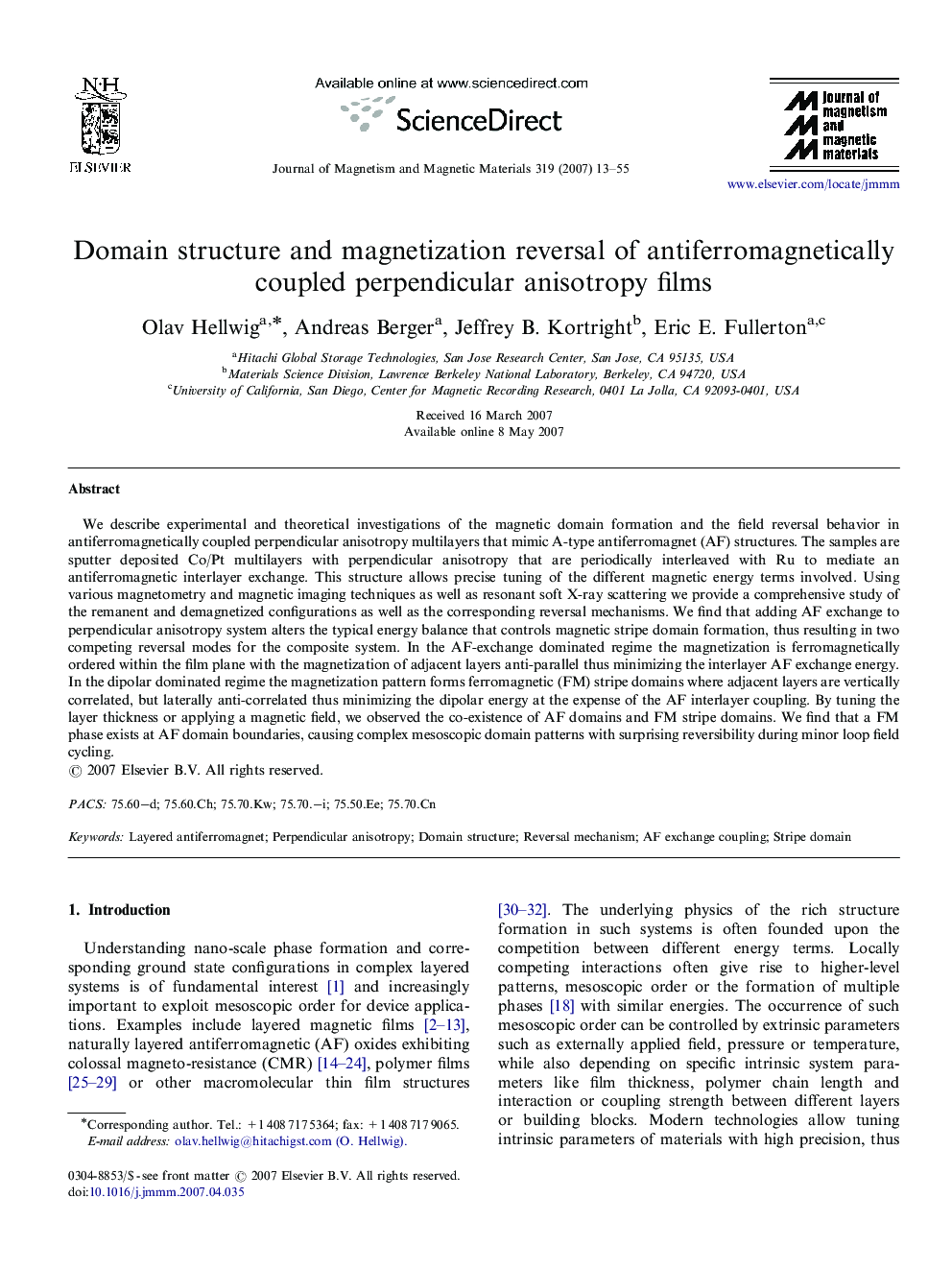 Domain structure and magnetization reversal of antiferromagnetically coupled perpendicular anisotropy films