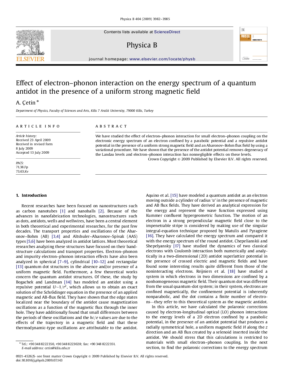 Effect of electron-phonon interaction on the energy spectrum of a quantum antidot in the presence of a uniform strong magnetic field