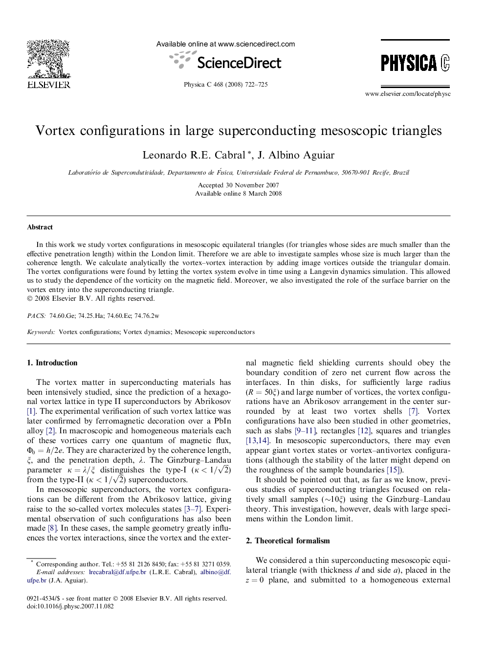 Vortex configurations in large superconducting mesoscopic triangles