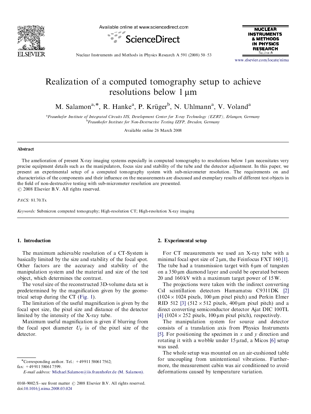 Realization of a computed tomography setup to achieve resolutions below 1 μm