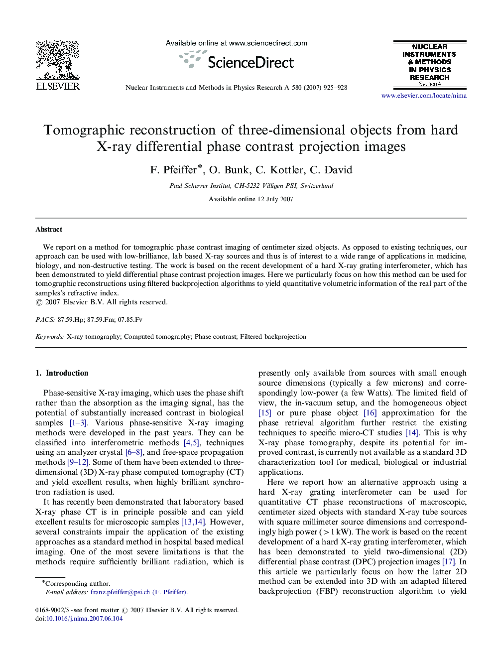 Tomographic reconstruction of three-dimensional objects from hard X-ray differential phase contrast projection images