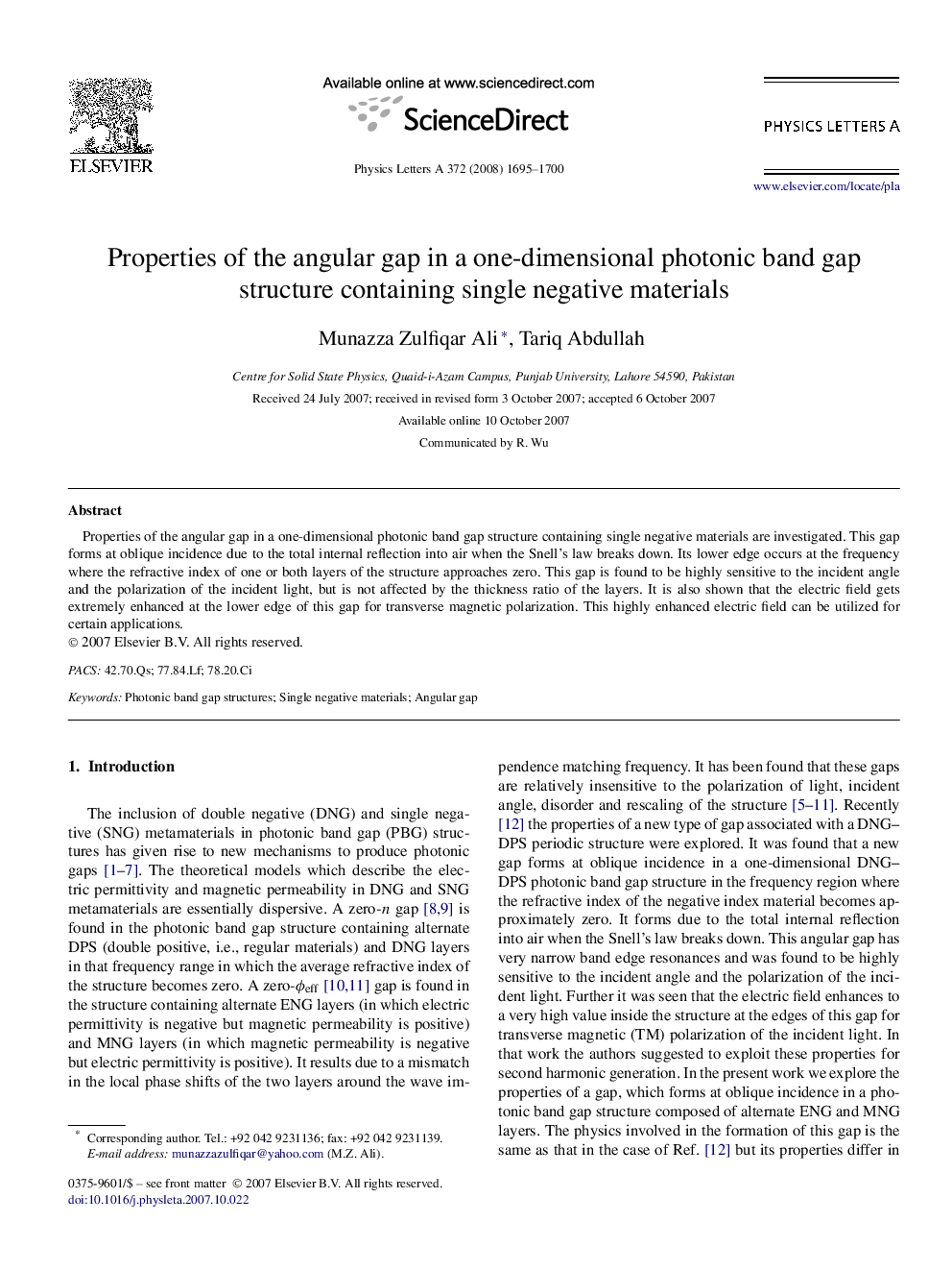 Properties of the angular gap in a one-dimensional photonic band gap structure containing single negative materials
