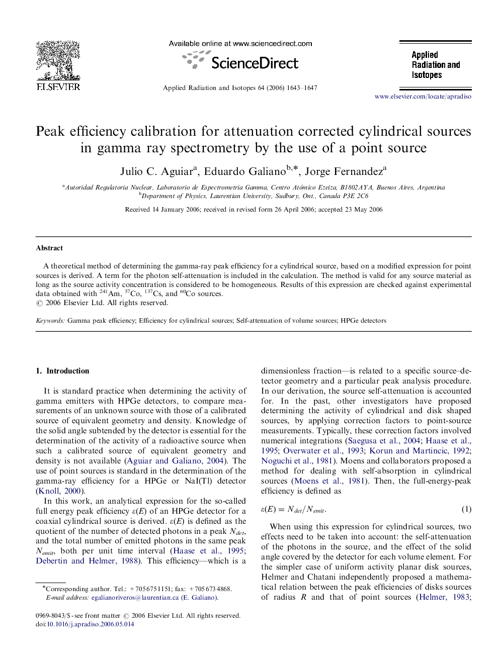 Peak efficiency calibration for attenuation corrected cylindrical sources in gamma ray spectrometry by the use of a point source