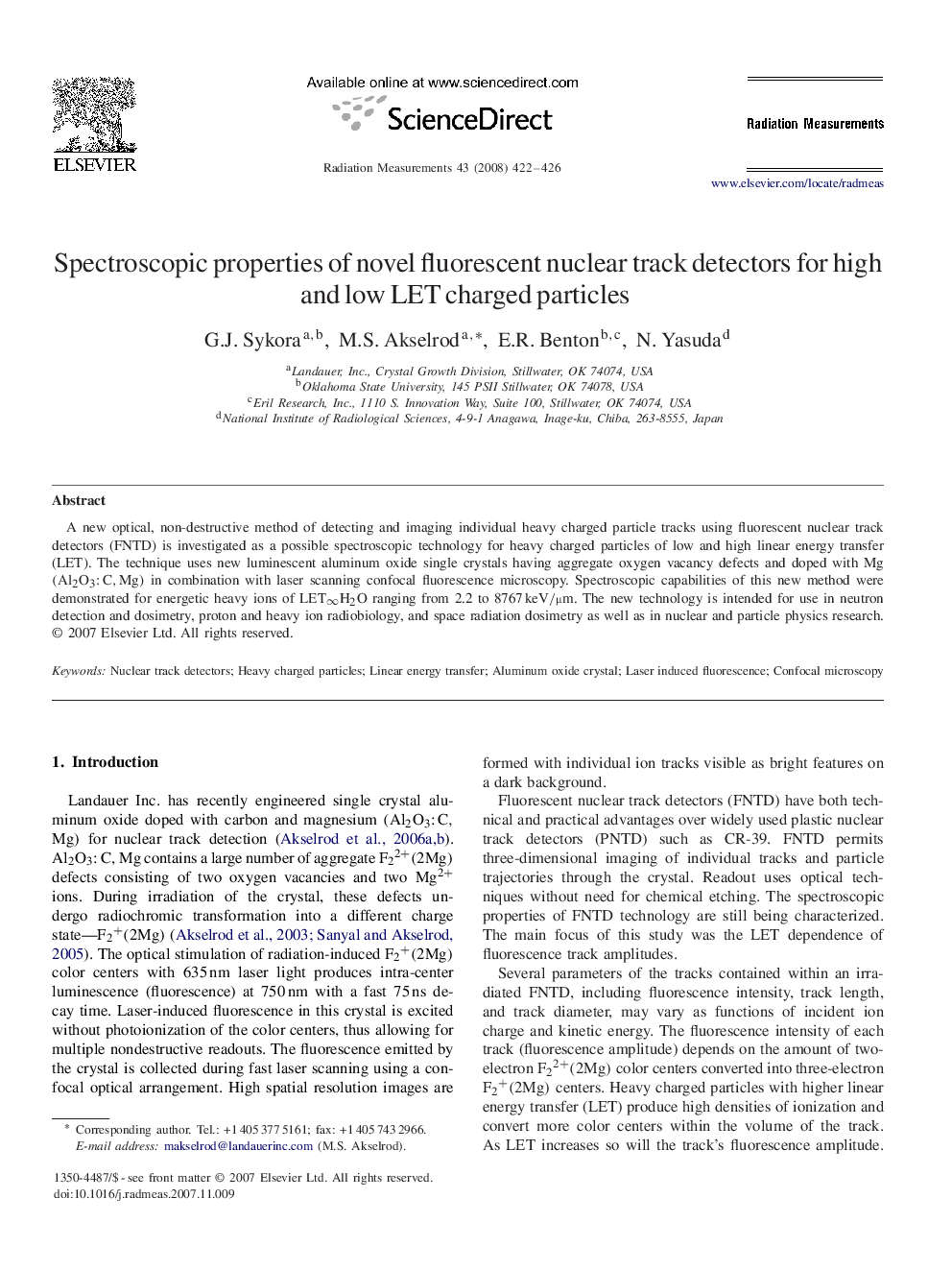 Spectroscopic properties of novel fluorescent nuclear track detectors for high and low LET charged particles