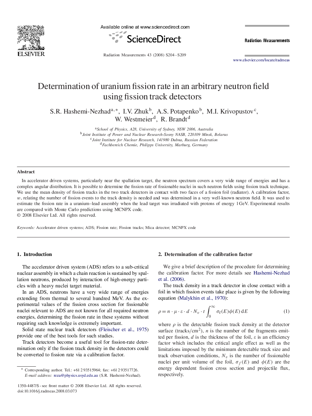 Determination of uranium fission rate in an arbitrary neutron field using fission track detectors