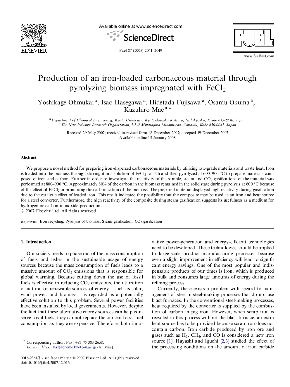 Production of an iron-loaded carbonaceous material through pyrolyzing biomass impregnated with FeCl2