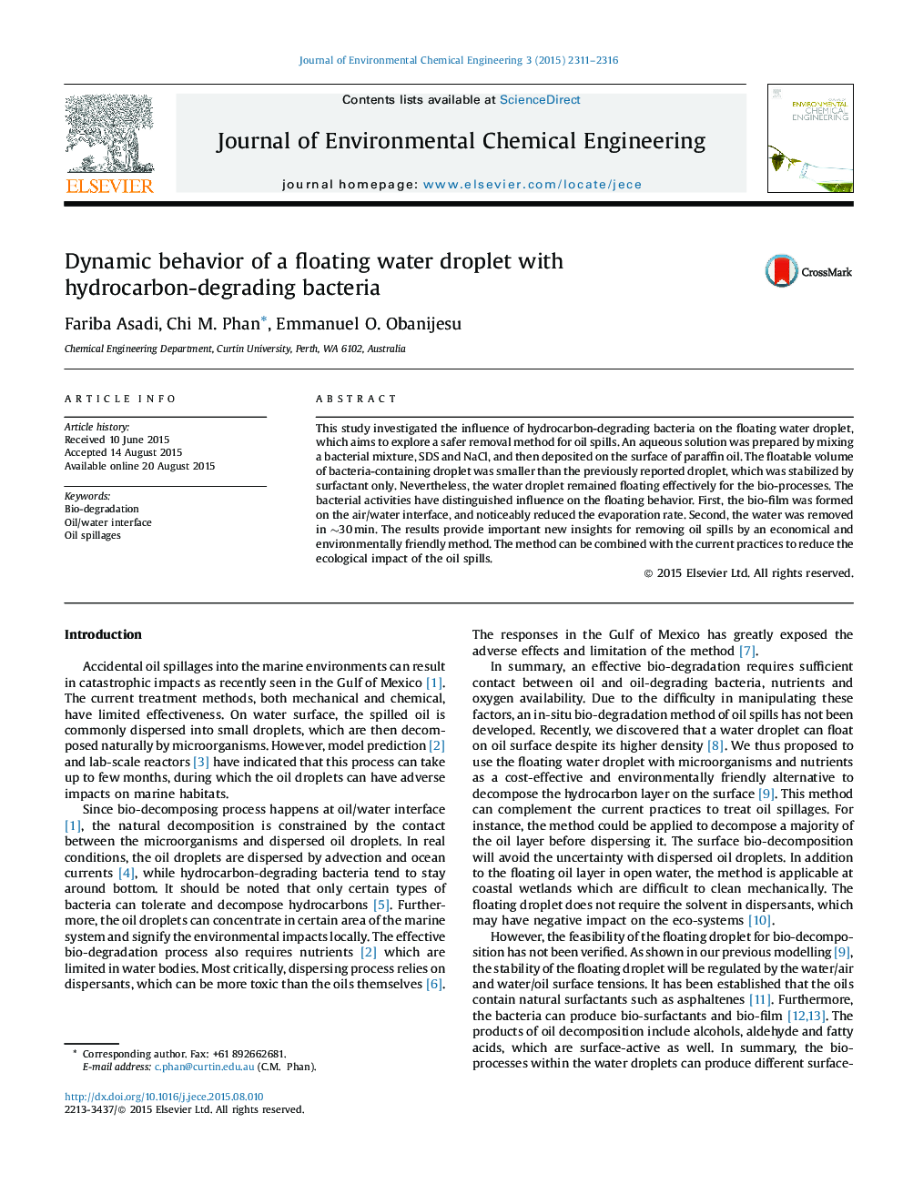 Dynamic behavior of a floating water droplet with hydrocarbon-degrading bacteria