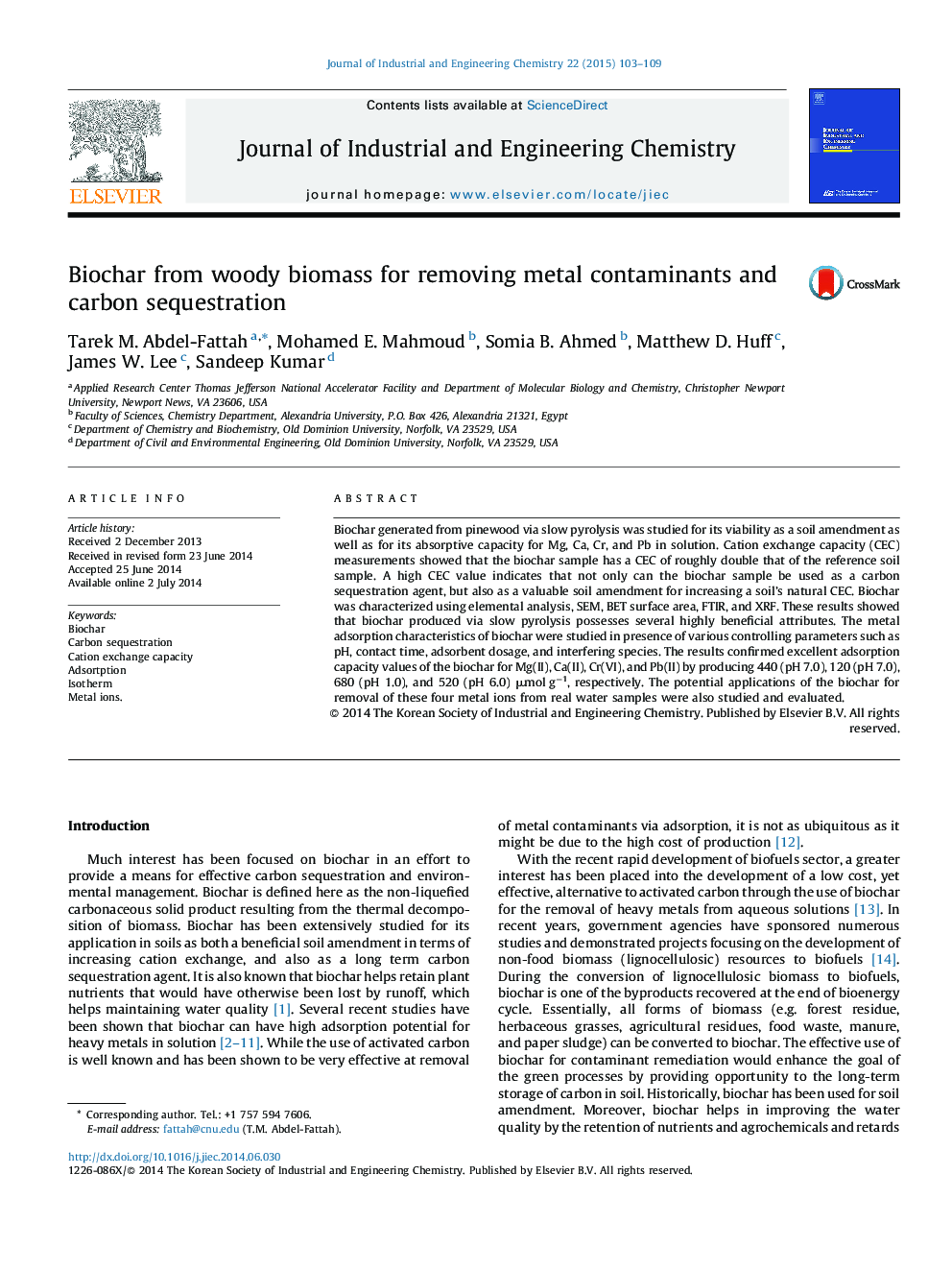 Biochar from woody biomass for removing metal contaminants and carbon sequestration