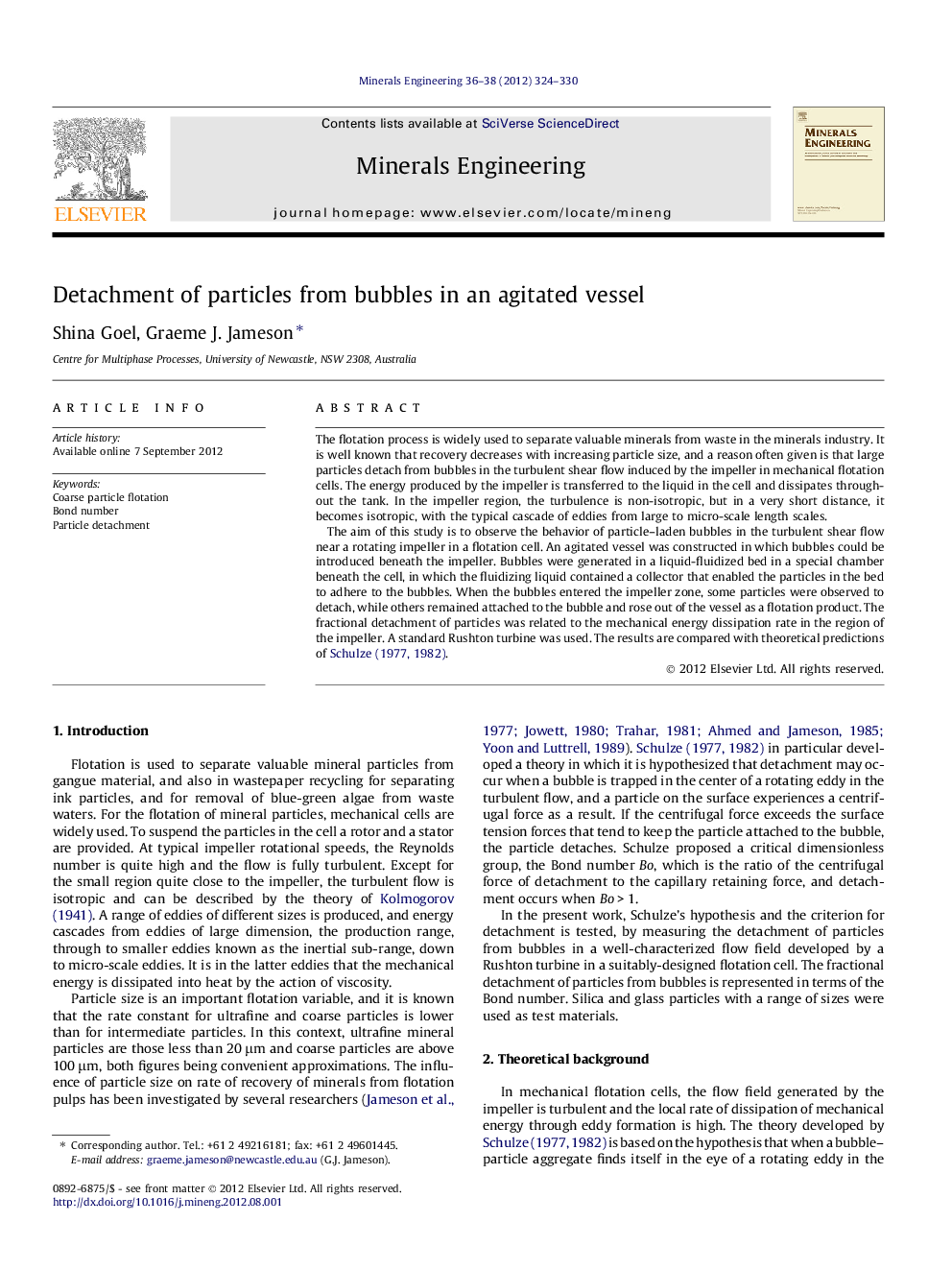 Detachment of particles from bubbles in an agitated vessel