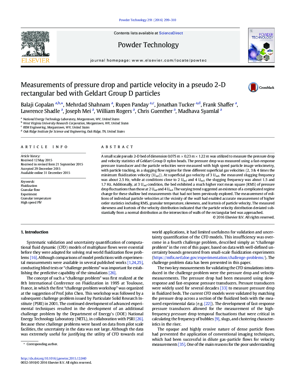 Measurements of pressure drop and particle velocity in a pseudo 2-D rectangular bed with Geldart Group D particles