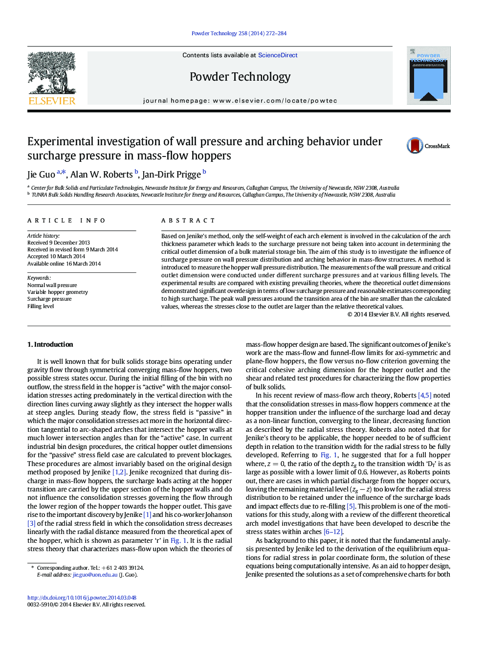 Experimental investigation of wall pressure and arching behavior under surcharge pressure in mass-flow hoppers