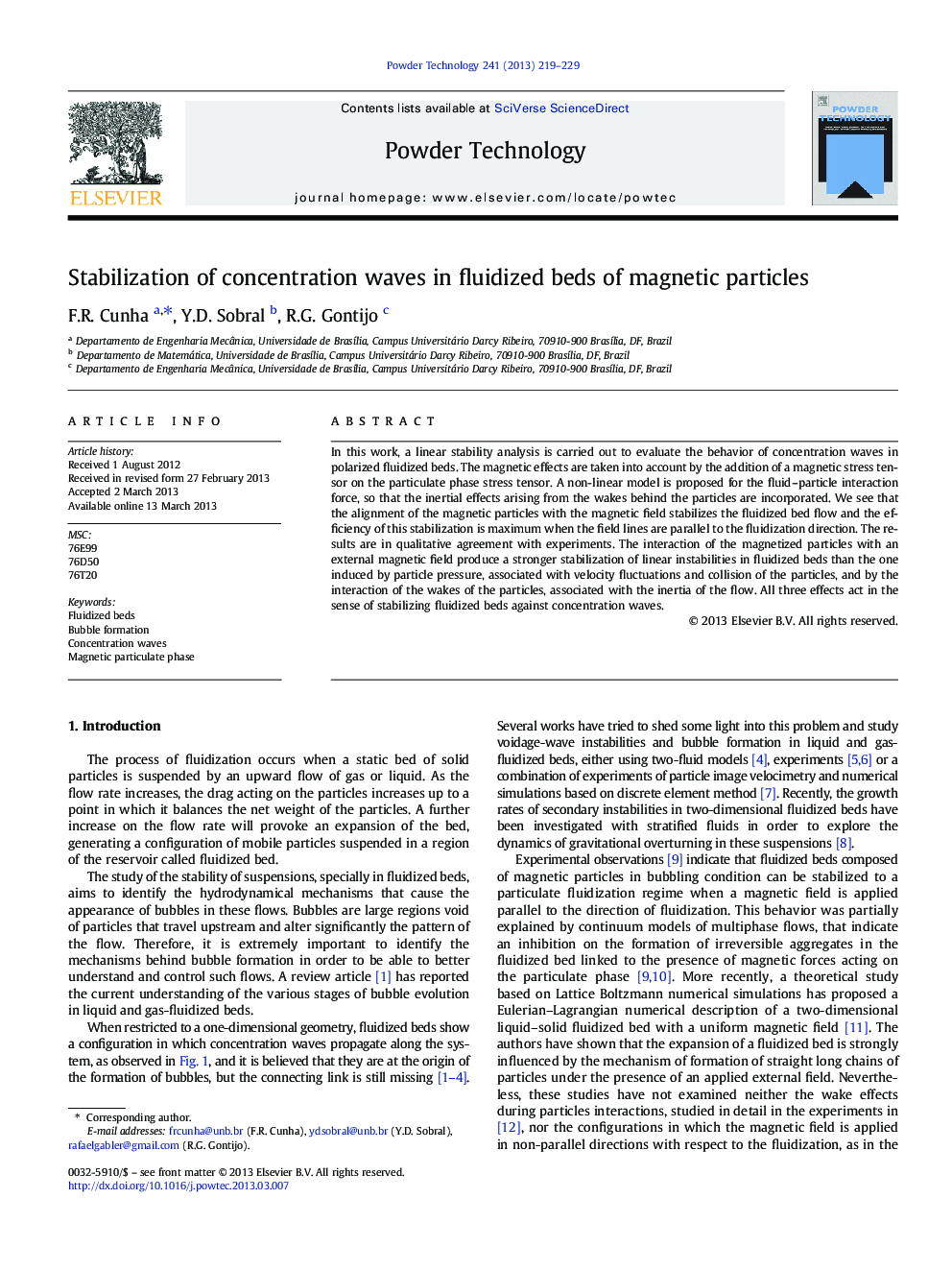 Stabilization of concentration waves in fluidized beds of magnetic particles