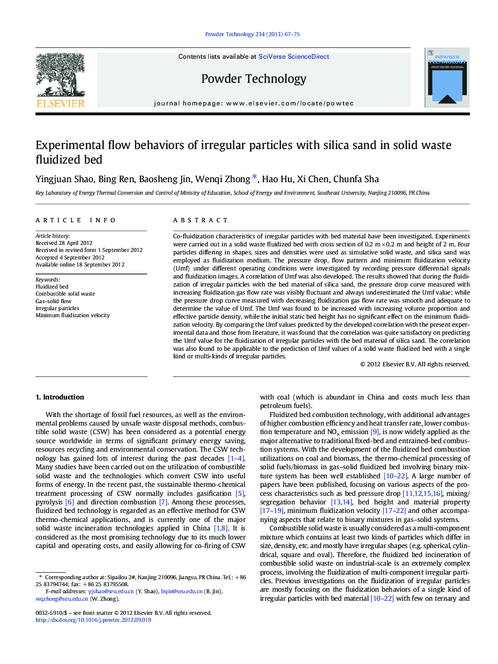 Experimental flow behaviors of irregular particles with silica sand in solid waste fluidized bed