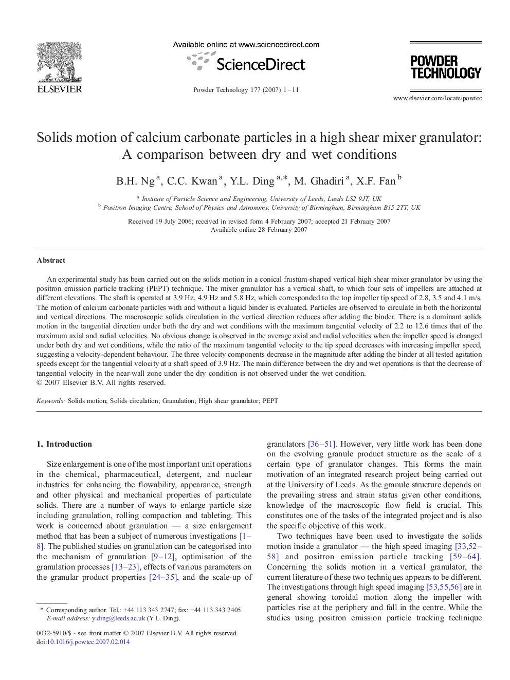 Solids motion of calcium carbonate particles in a high shear mixer granulator: A comparison between dry and wet conditions