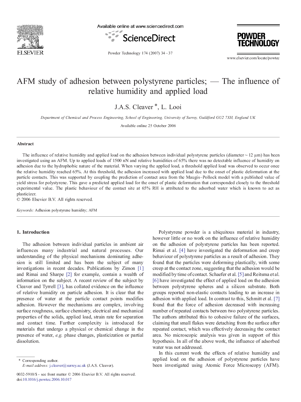 AFM study of adhesion between polystyrene particles; — The influence of relative humidity and applied load
