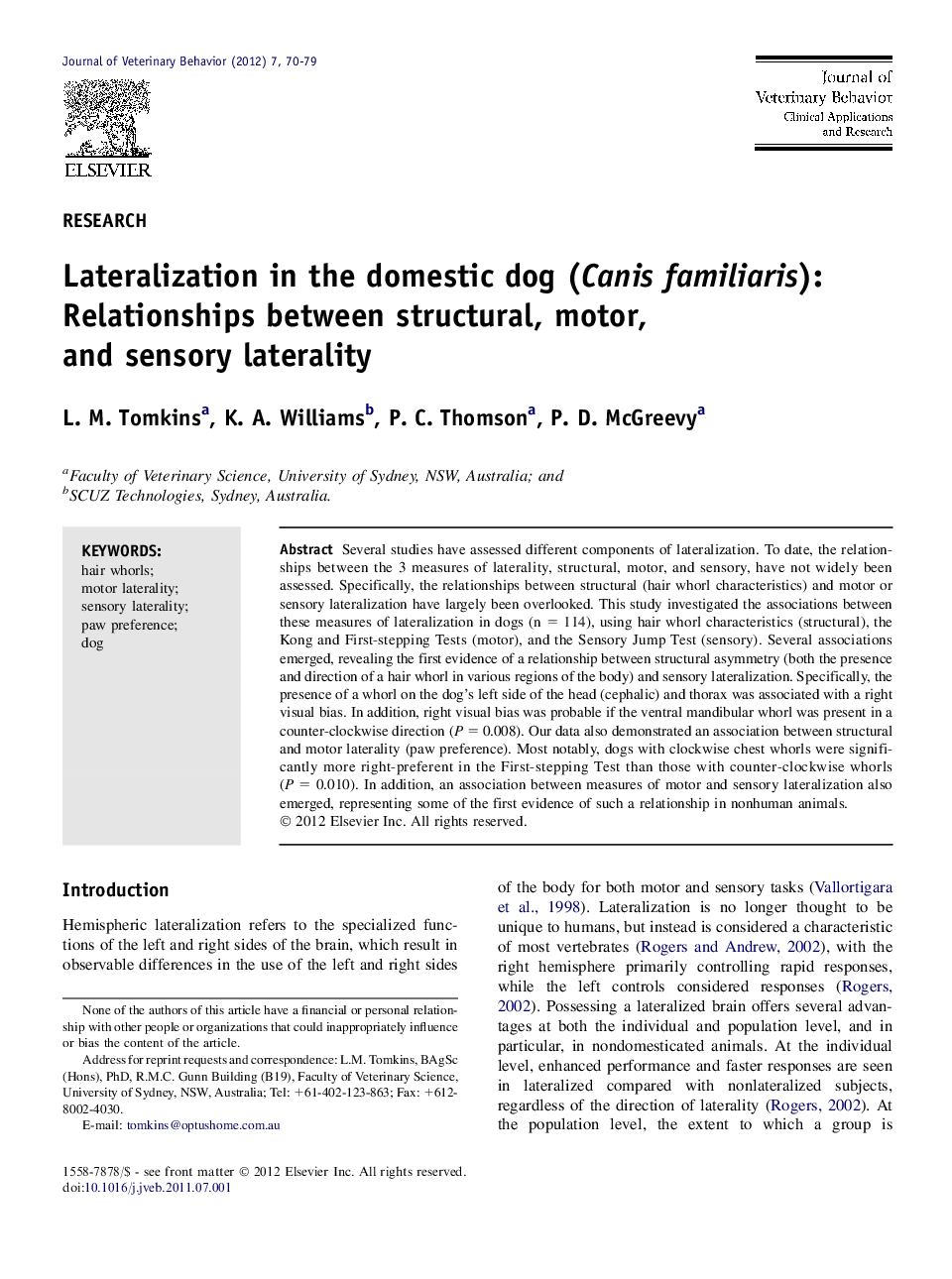 Lateralization in the domestic dog (Canis familiaris): Relationships between structural, motor, and sensory laterality 