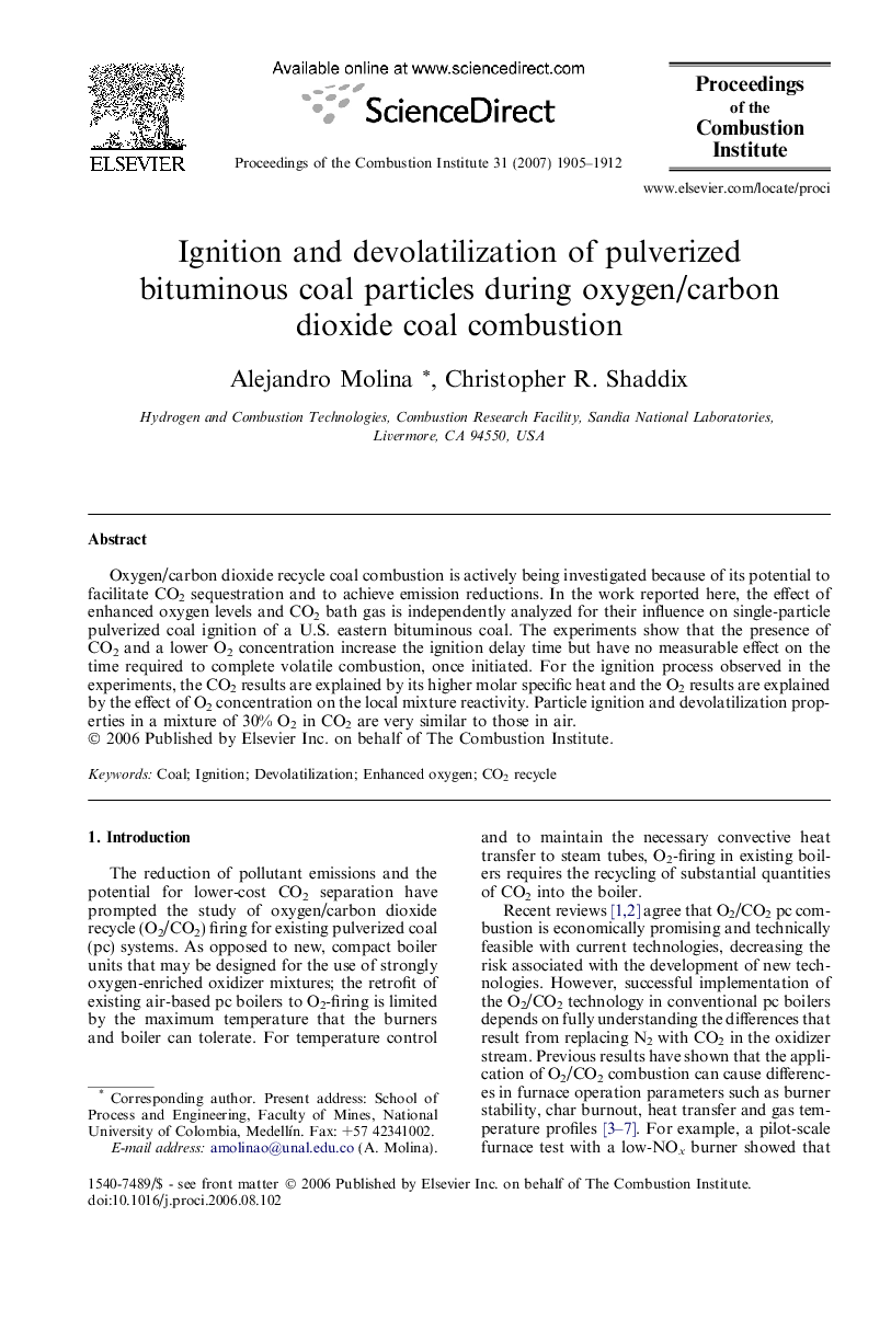 Ignition and devolatilization of pulverized bituminous coal particles during oxygen/carbon dioxide coal combustion