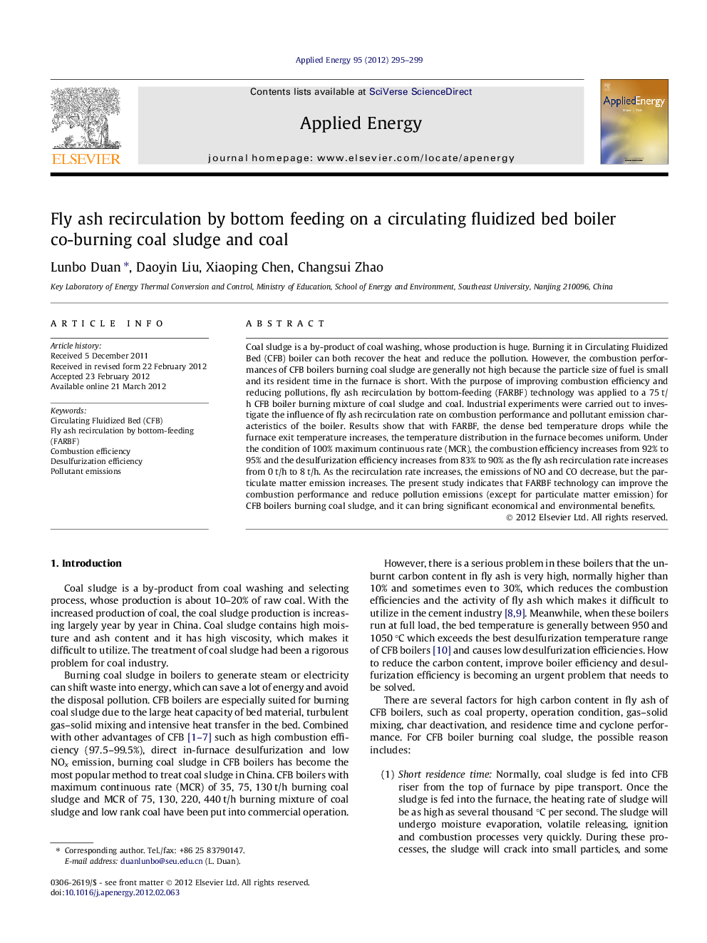 Fly ash recirculation by bottom feeding on a circulating fluidized bed boiler co-burning coal sludge and coal