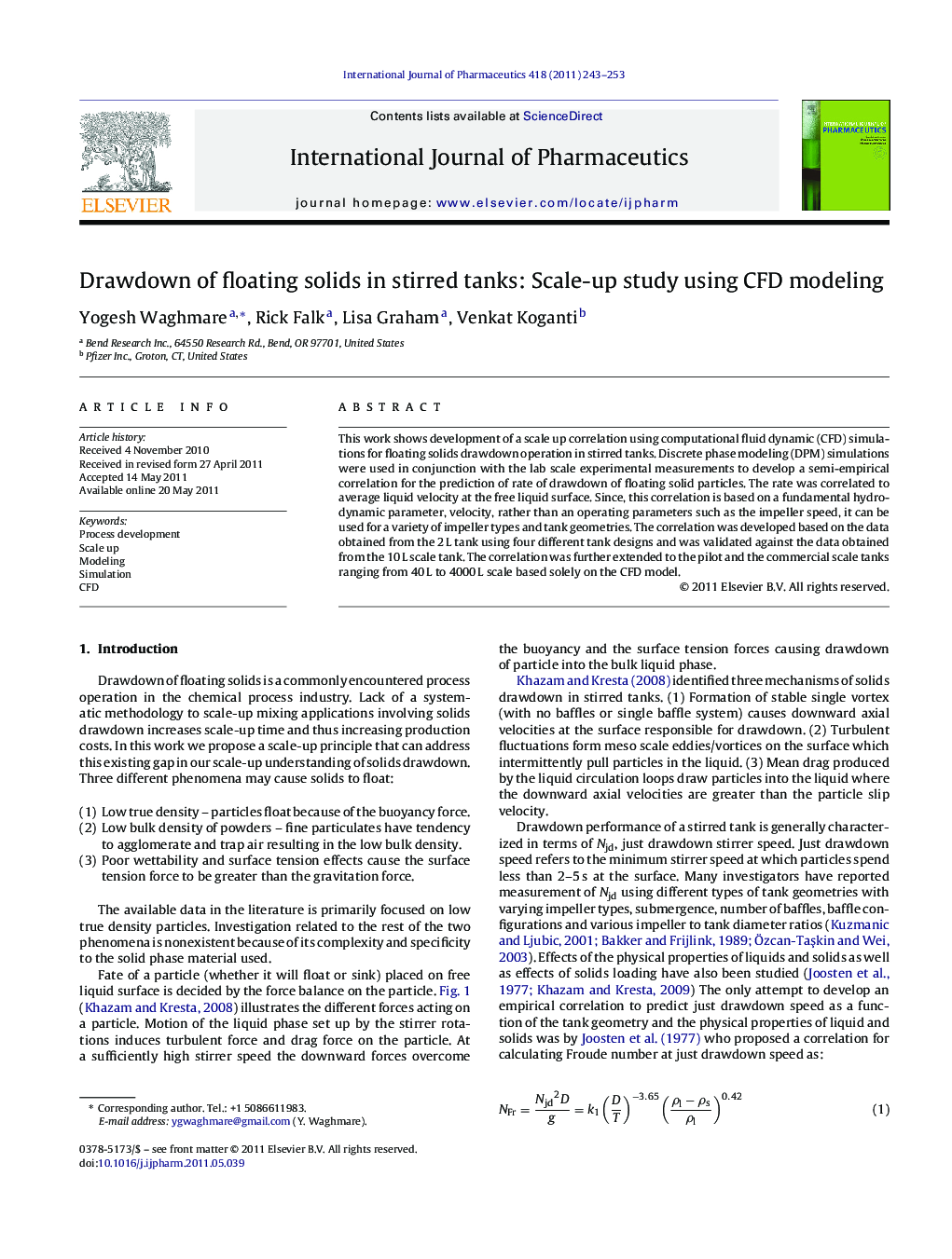 Drawdown of floating solids in stirred tanks: Scale-up study using CFD modeling