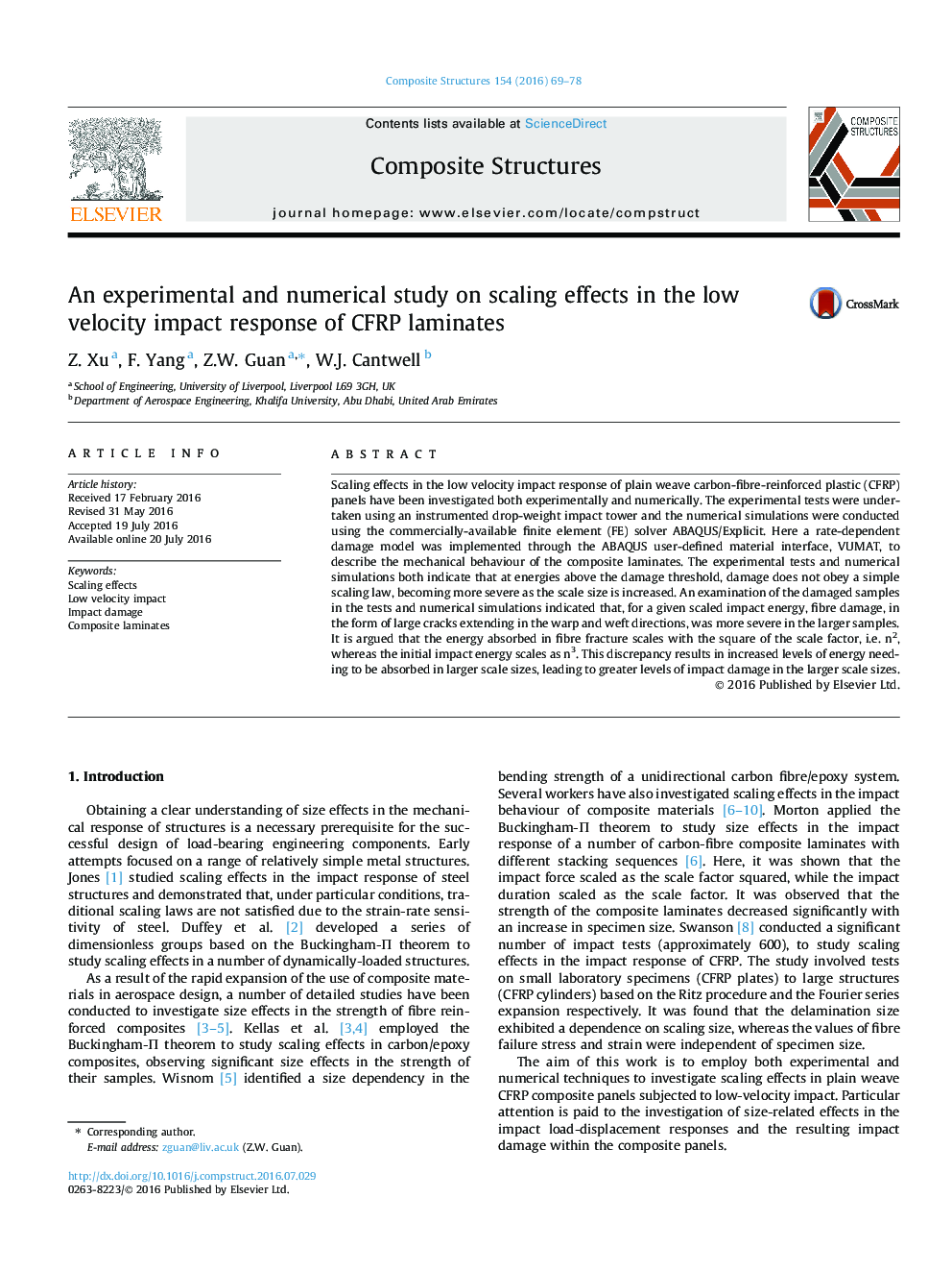 An experimental and numerical study on scaling effects in the low velocity impact response of CFRP laminates