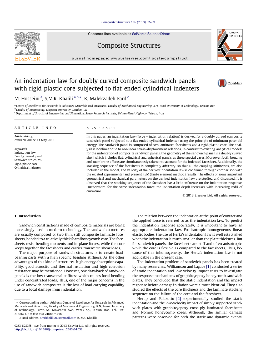 An indentation law for doubly curved composite sandwich panels with rigid-plastic core subjected to flat-ended cylindrical indenters